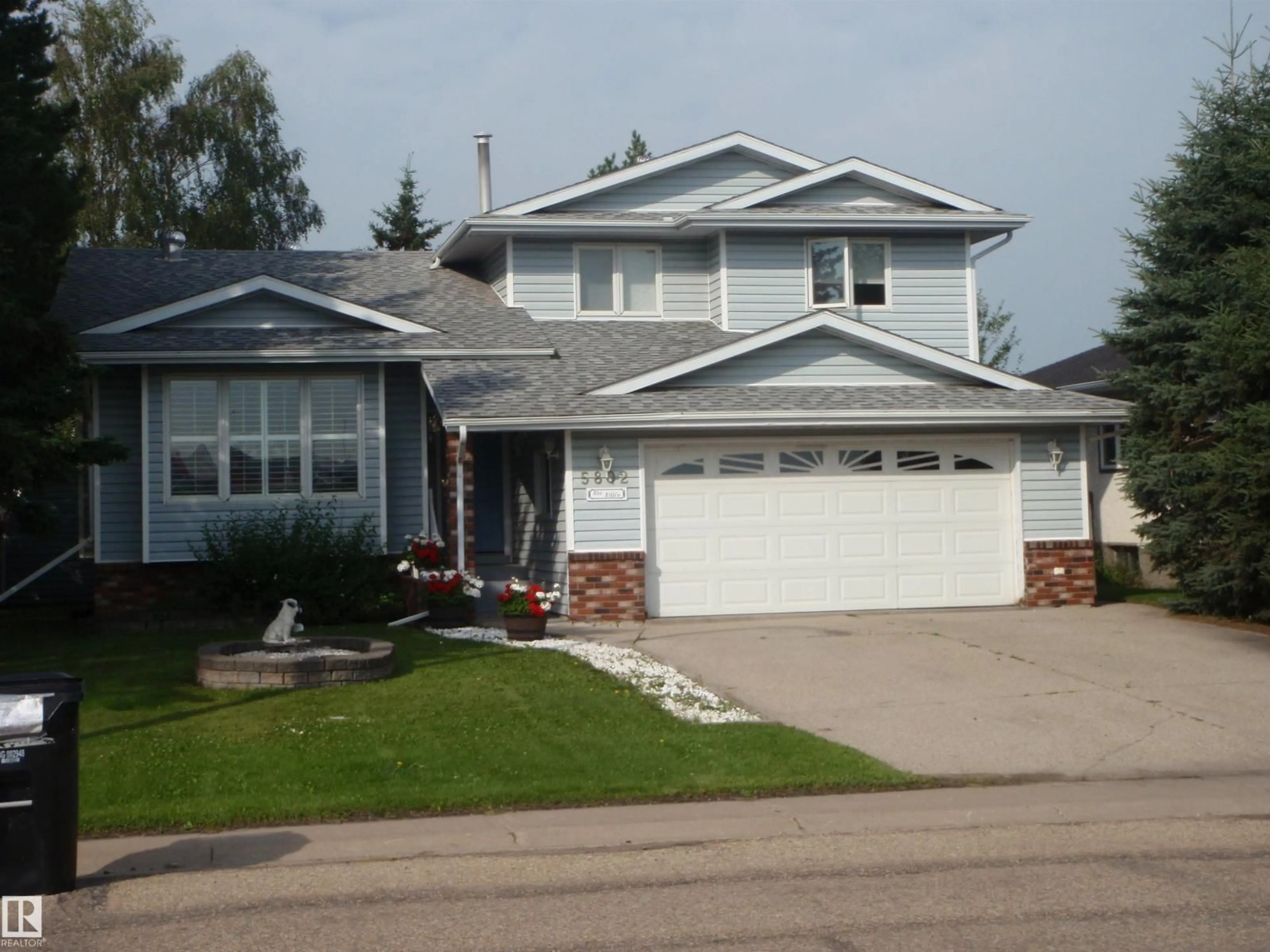 Home with vinyl exterior material, street for 5802 53 ST, Barrhead Alberta T7N1N1