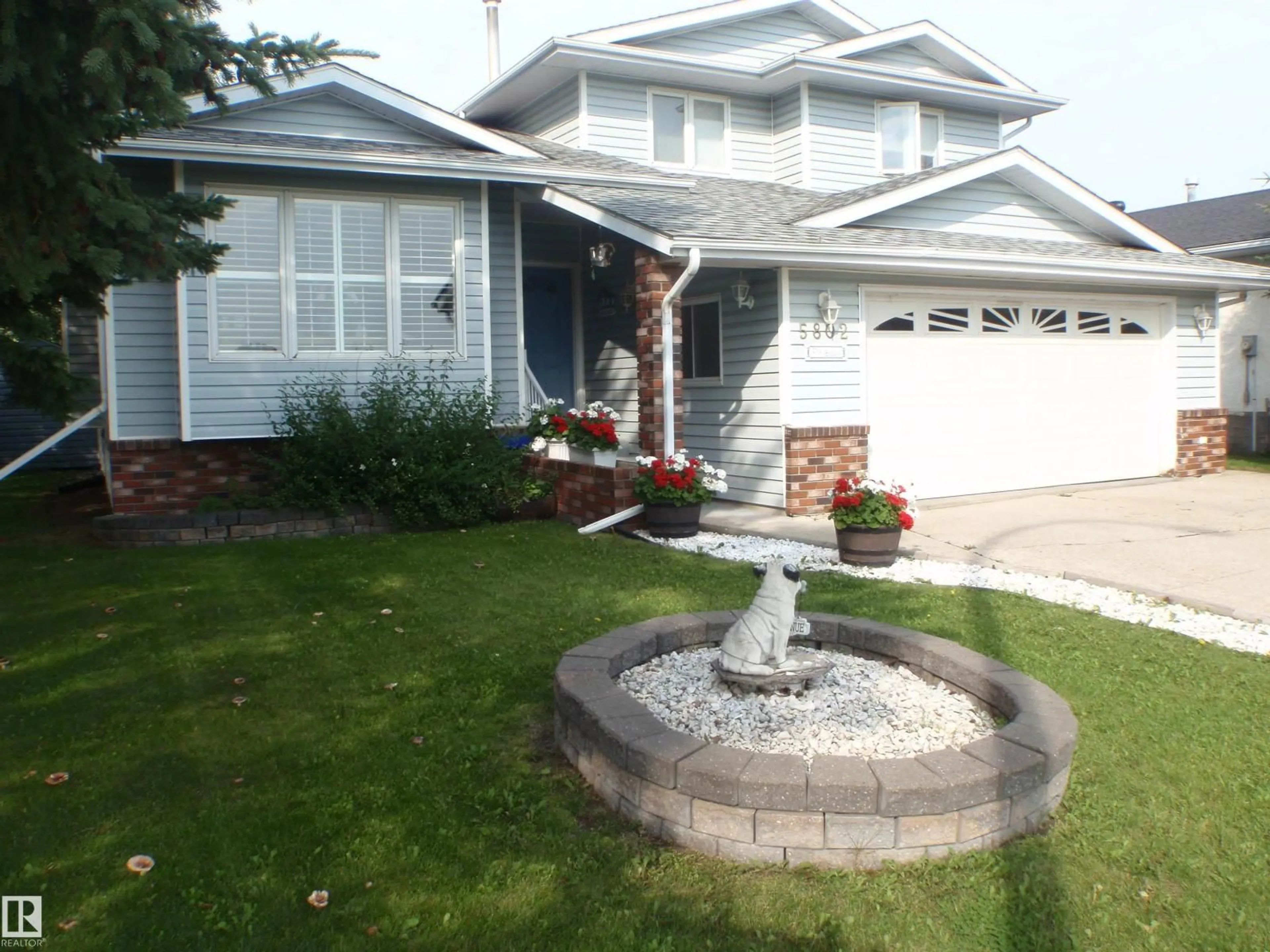 Home with vinyl exterior material, street for 5802 53 ST, Barrhead Alberta T7N1N1
