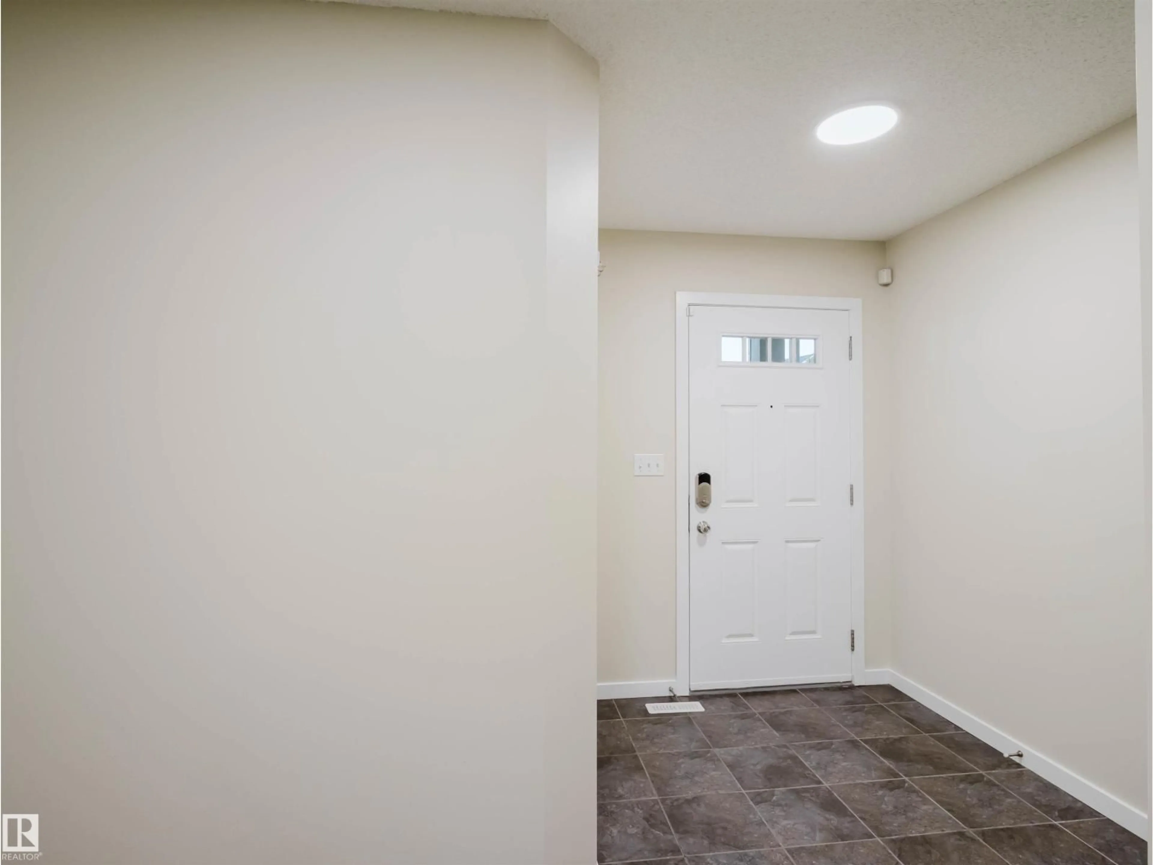 Indoor entryway for 5407 14 AV, Edmonton Alberta T6X1S2