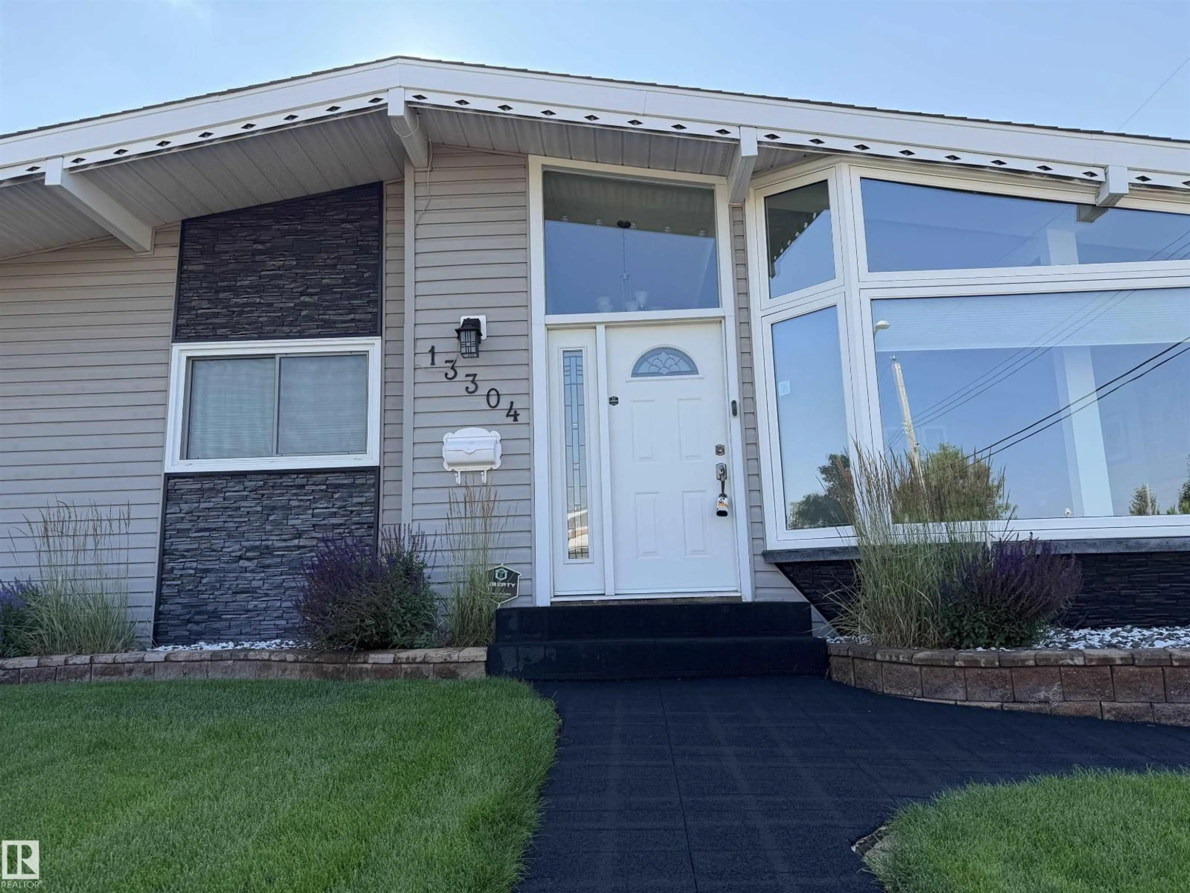Home with vinyl exterior material, street for NW - 13304 70 ST, Edmonton Alberta T5C0K3