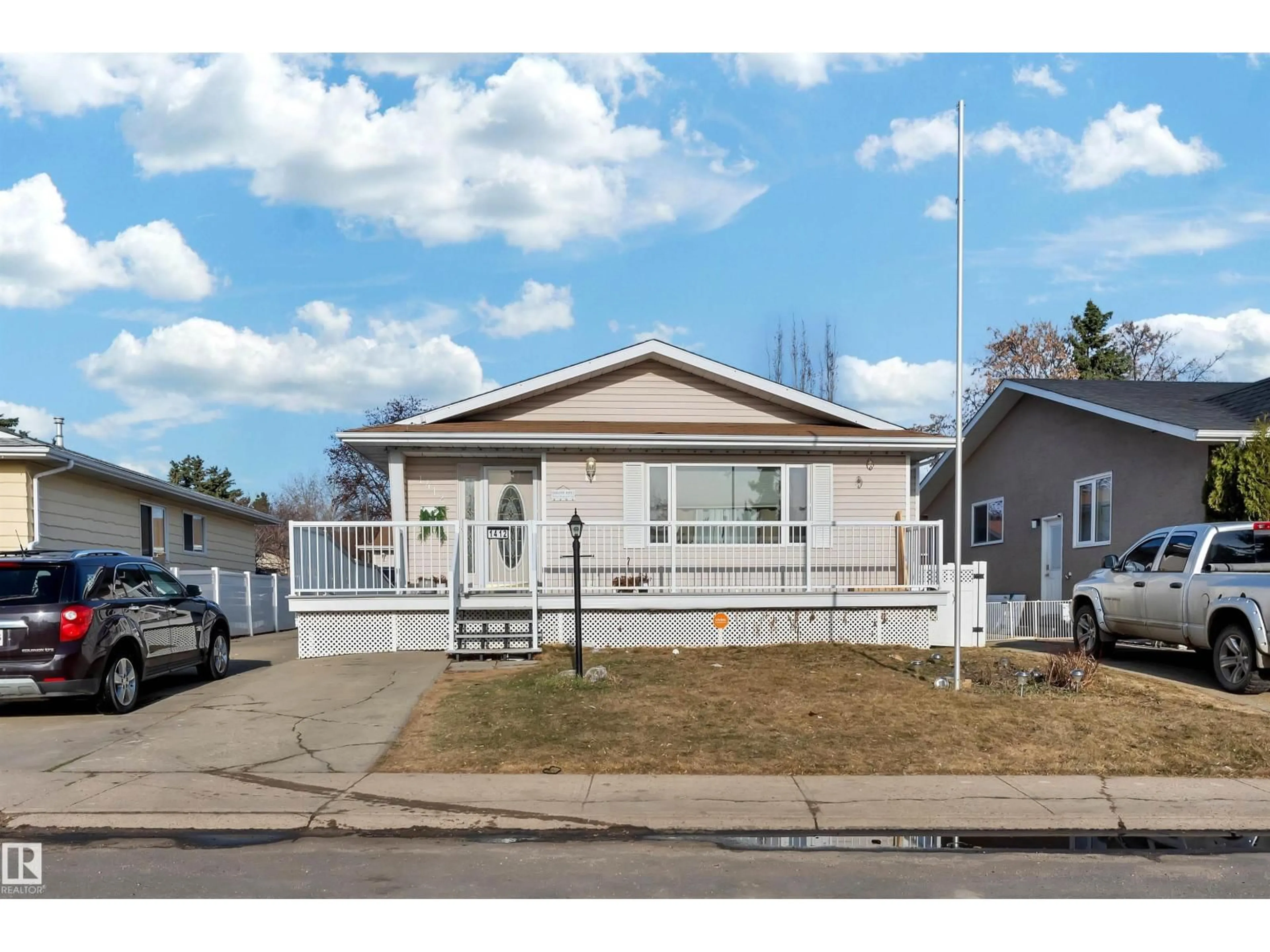Home with vinyl exterior material, street for NW - 1412 63 ST, Edmonton Alberta T6L1X7