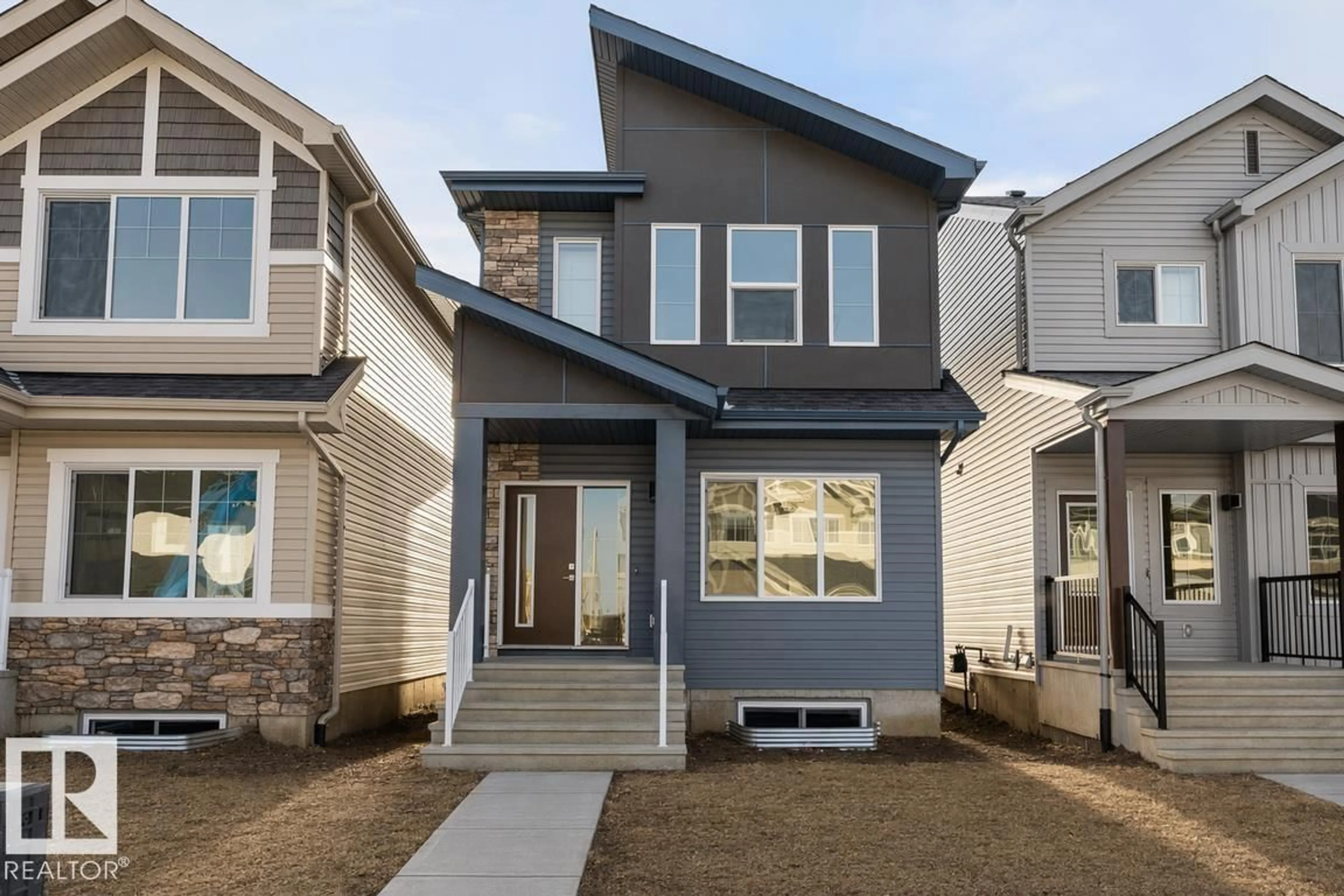 Home with vinyl exterior material, street for 18855 29 AV, Edmonton Alberta T6M3C5