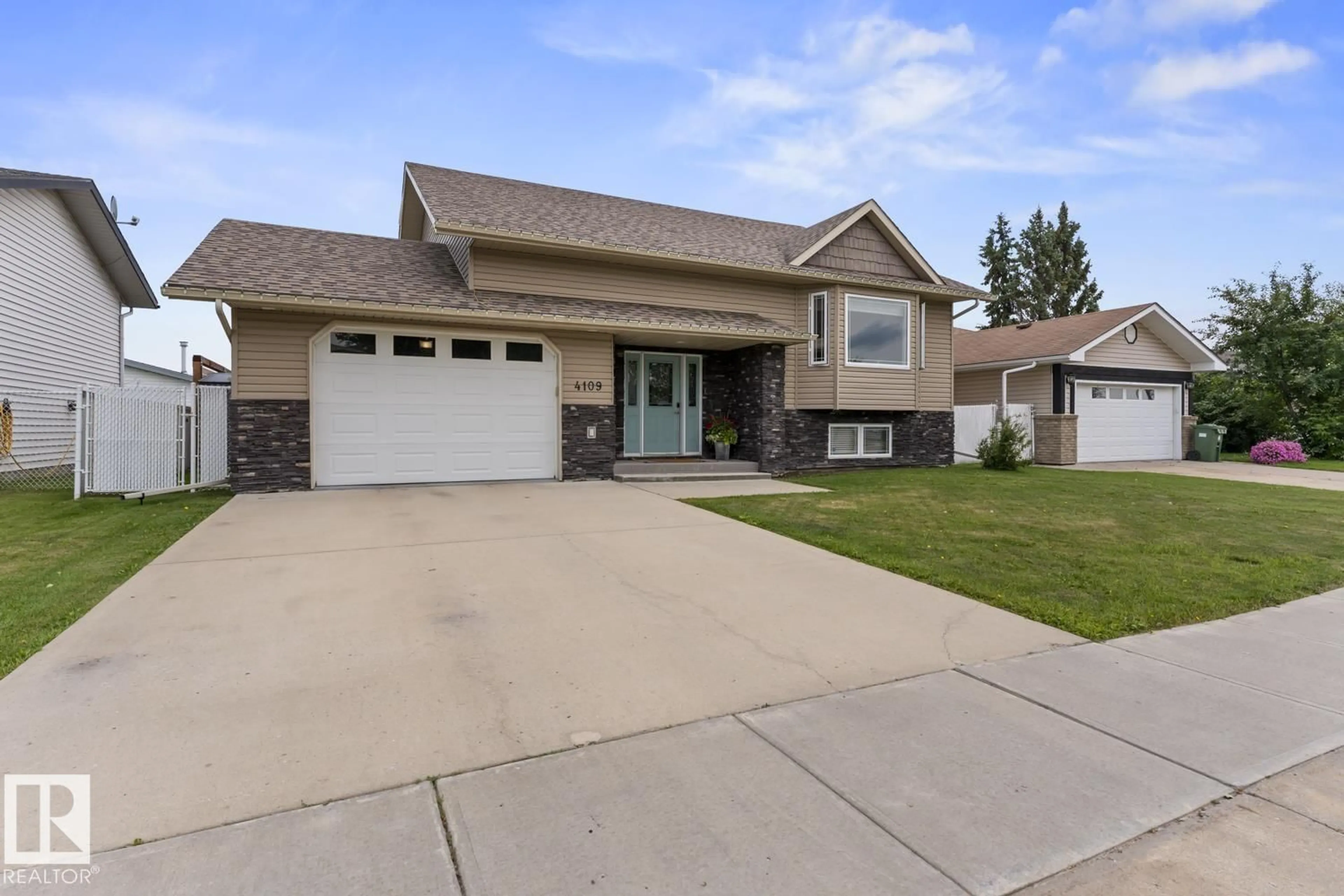 Home with vinyl exterior material, street for 4109 40 ST, Bonnyville Town Alberta T9N1T5