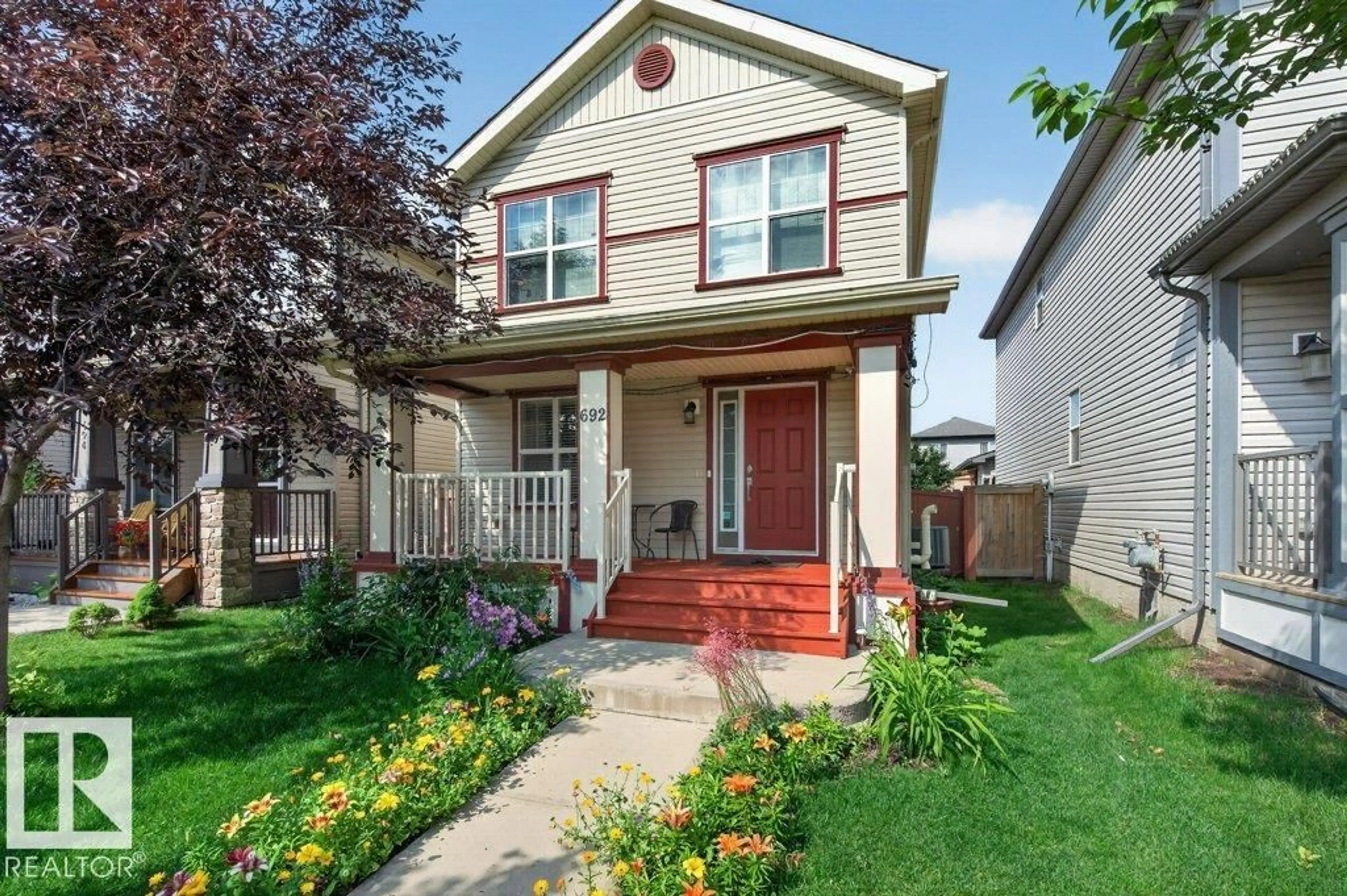 Home with vinyl exterior material, street for 692 SECORD BV, Edmonton Alberta T5T6Z6