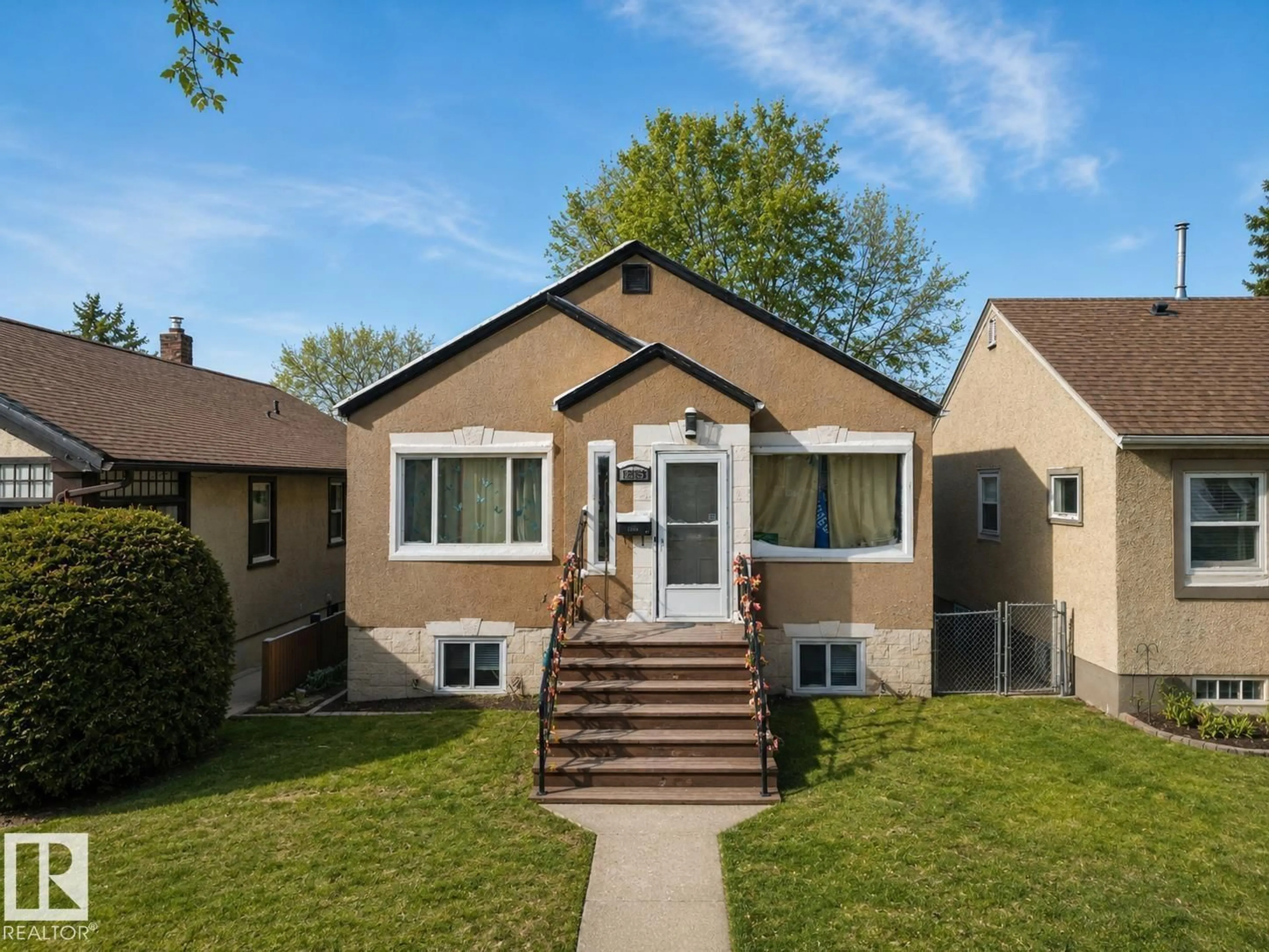 Home with vinyl exterior material, street for NW - 12758 117 ST, Edmonton Alberta T5E5J5