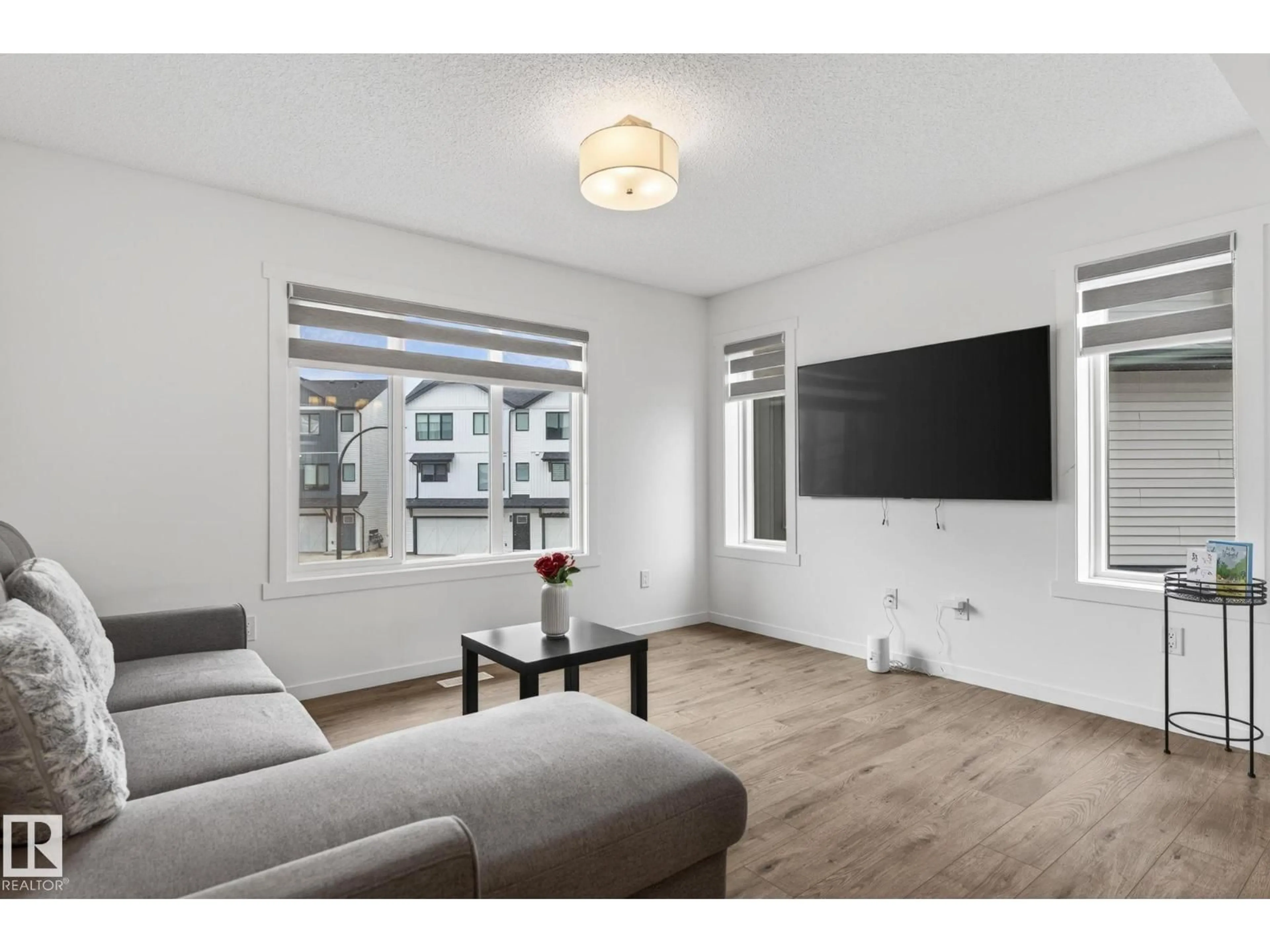 Living room with furniture, wood/laminate floor for #44 - 1025 SECORD PM NW, Edmonton Alberta T5T7V4