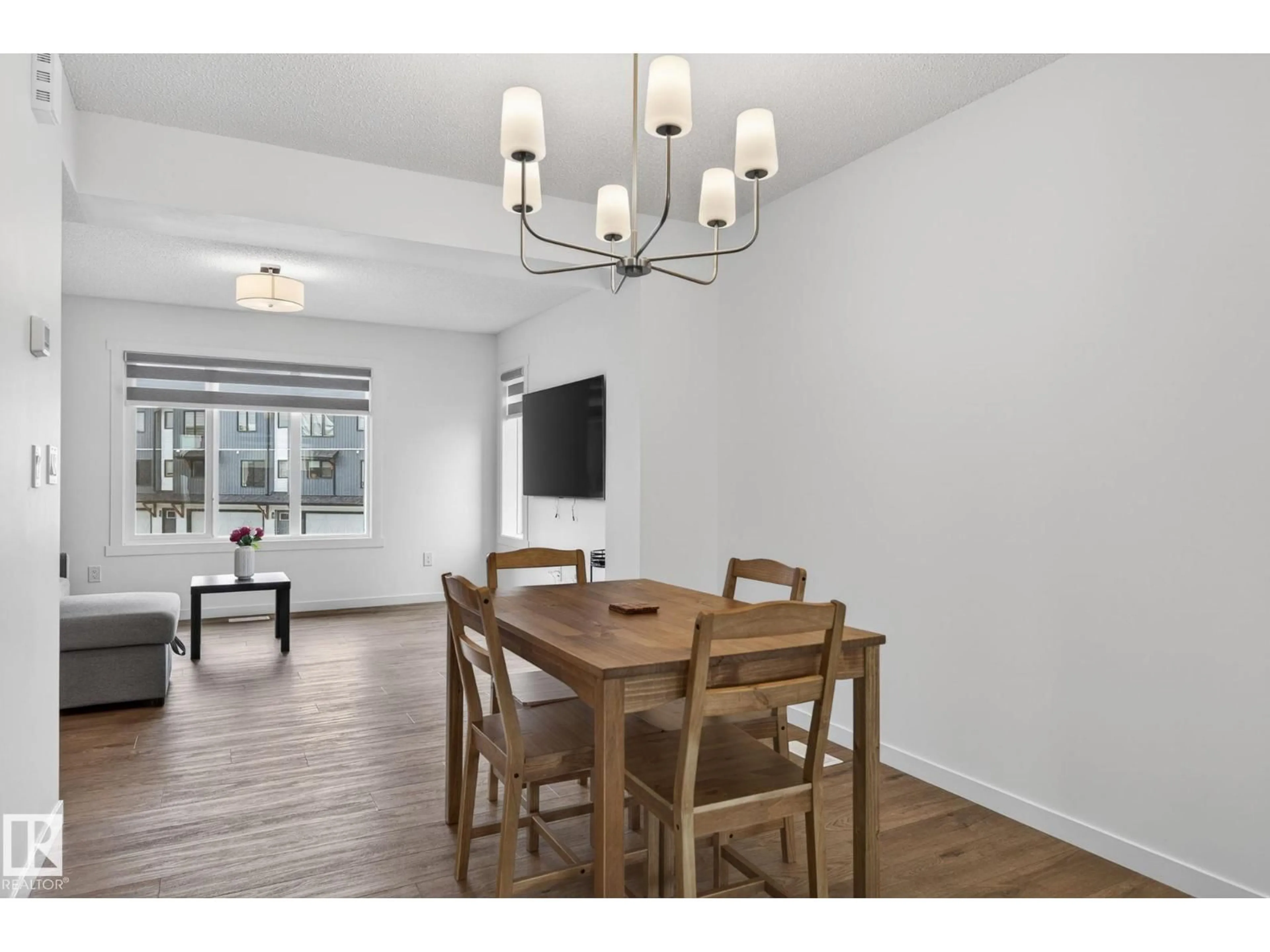 Dining room, wood/laminate floor for #44 - 1025 SECORD PM NW, Edmonton Alberta T5T7V4
