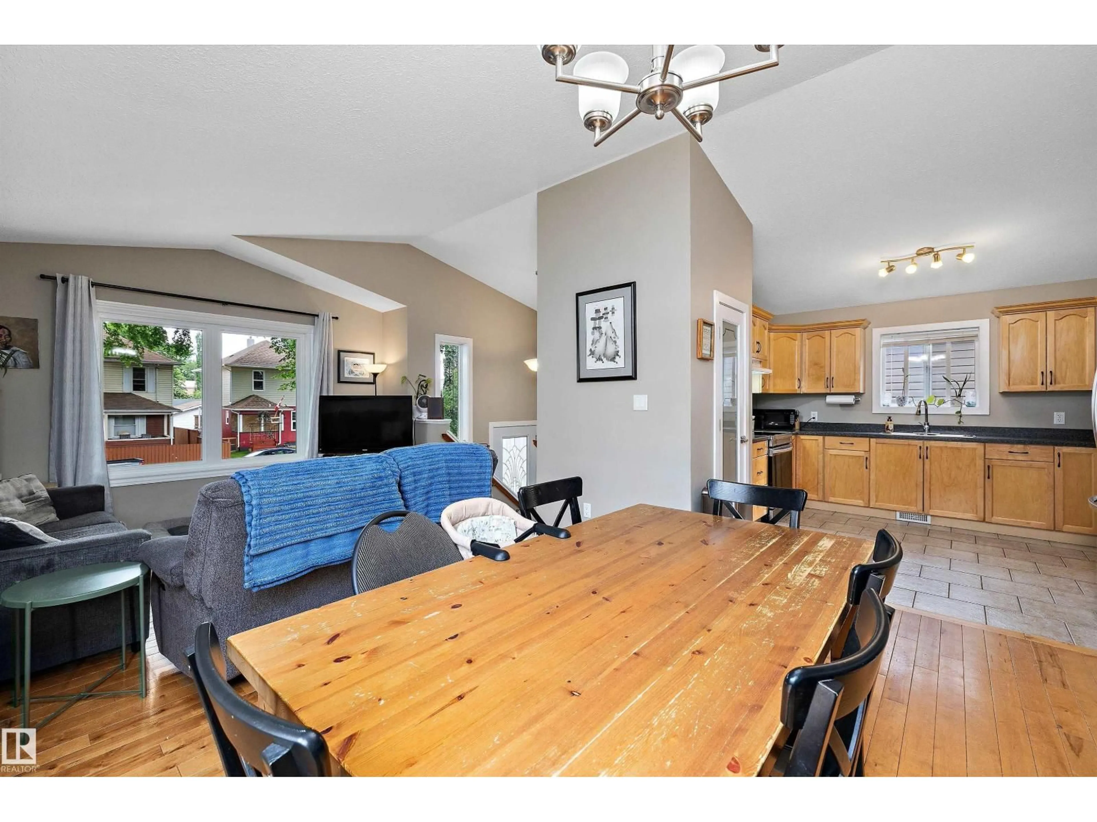 Open concept kitchen, wood/laminate floor for NW - 11432 87 ST, Edmonton Alberta T5B3M1
