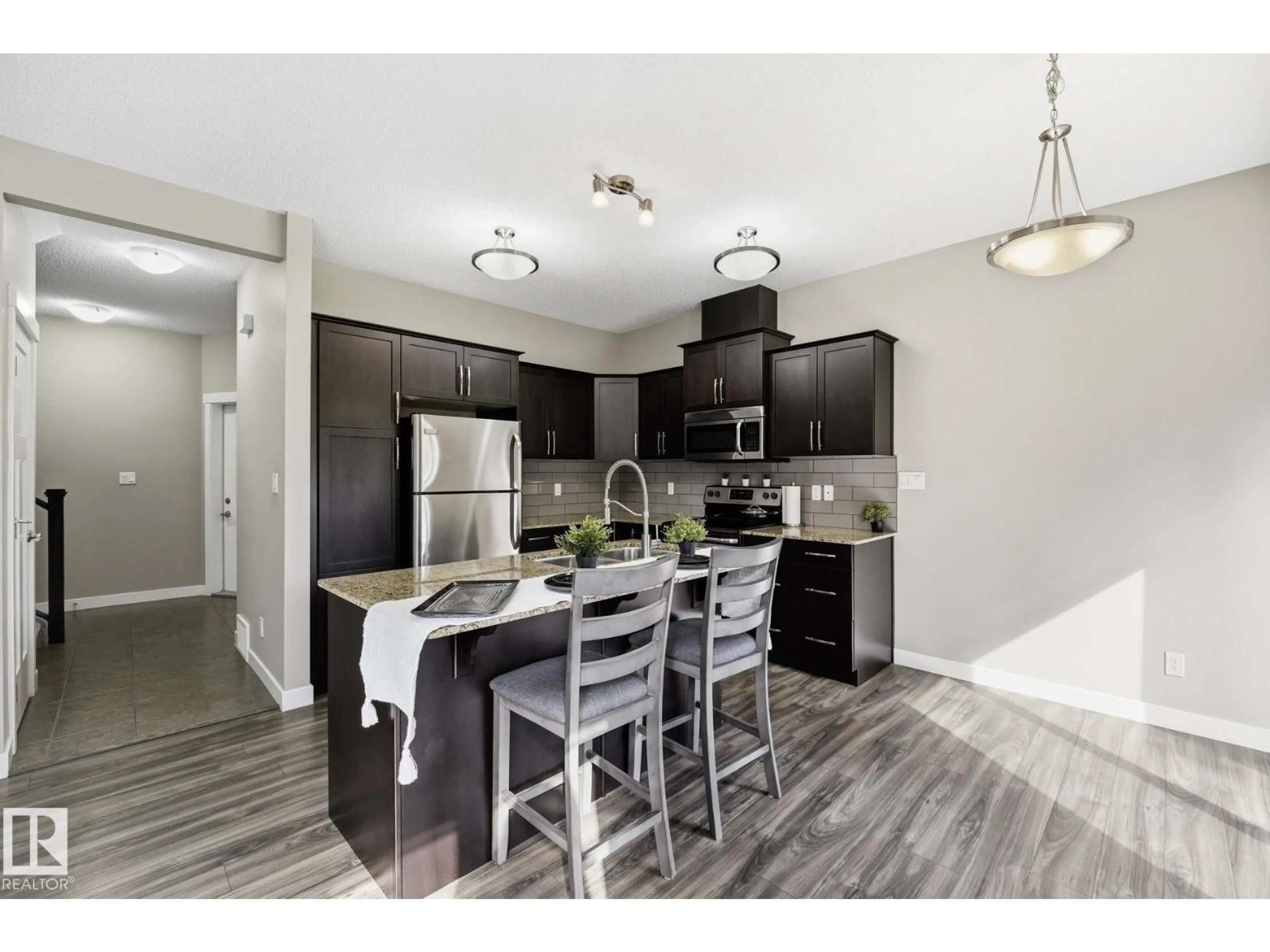 Open concept kitchen, wood/laminate floor for 9 - 94 LONGVIEW DR, Spruce Grove Alberta T7X0W3
