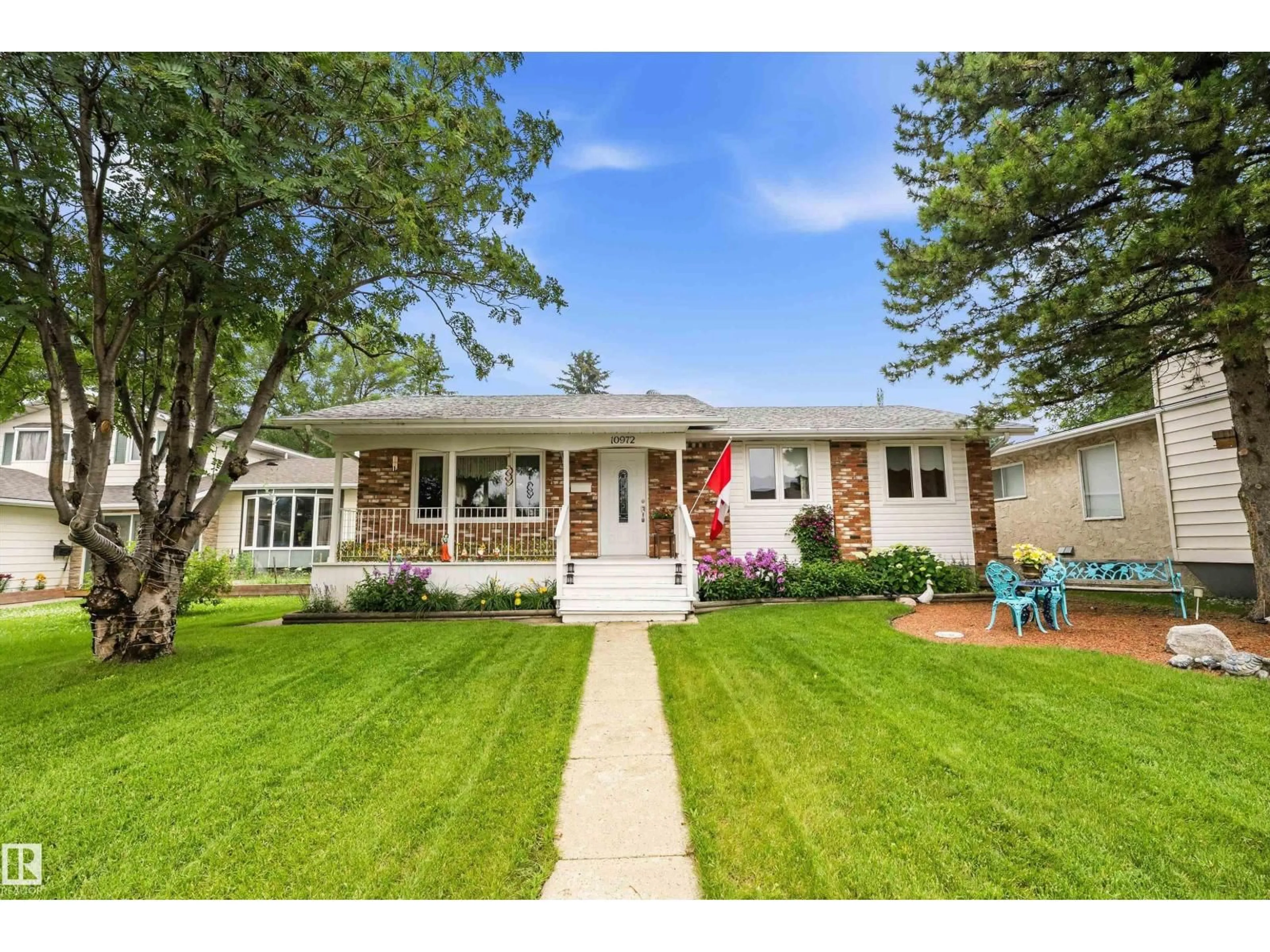 Home with vinyl exterior material, street for NW - 10972 35 AV, Edmonton Alberta T6J2V3