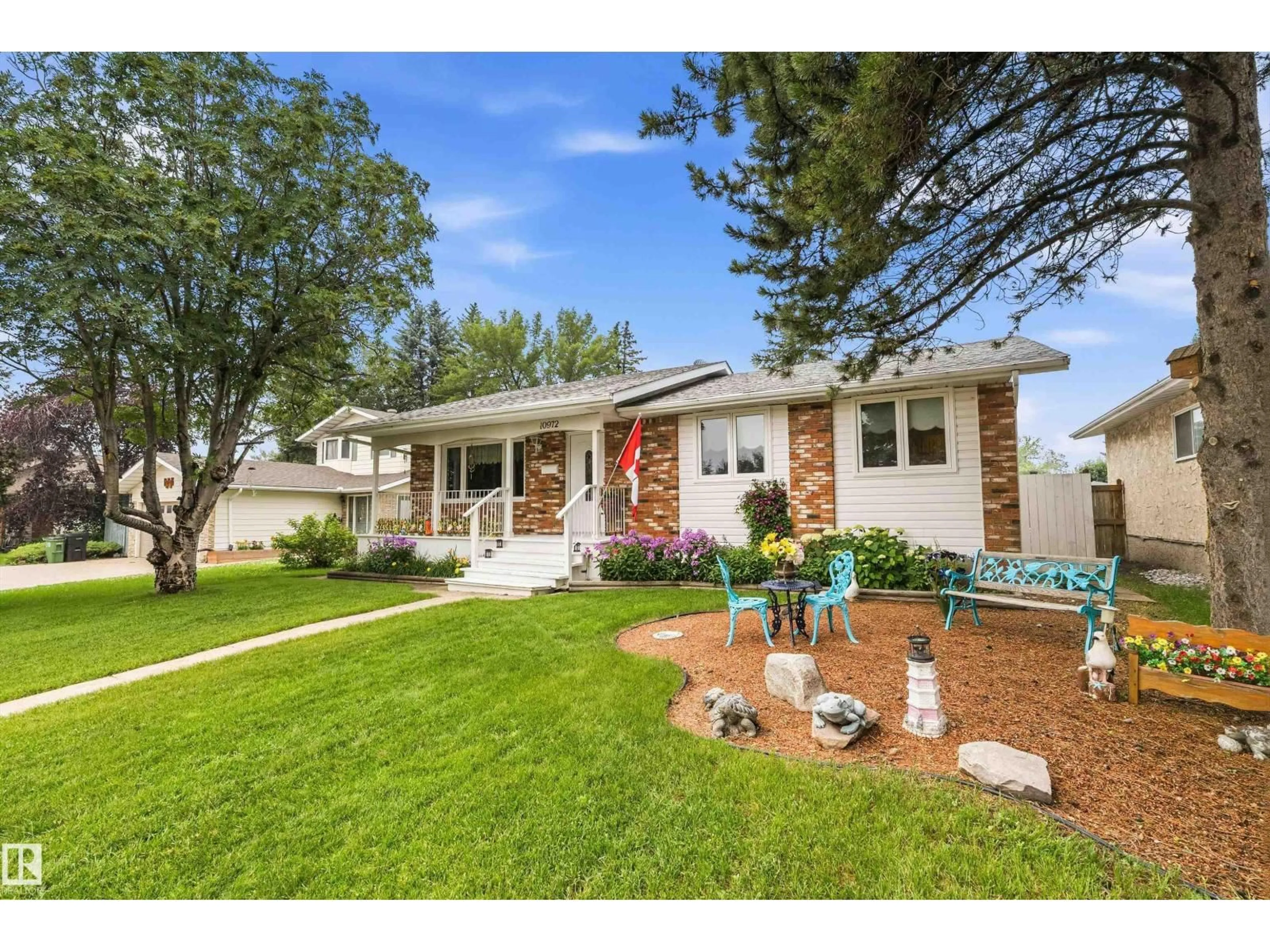 Home with vinyl exterior material, street for NW - 10972 35 AV, Edmonton Alberta T6J2V3