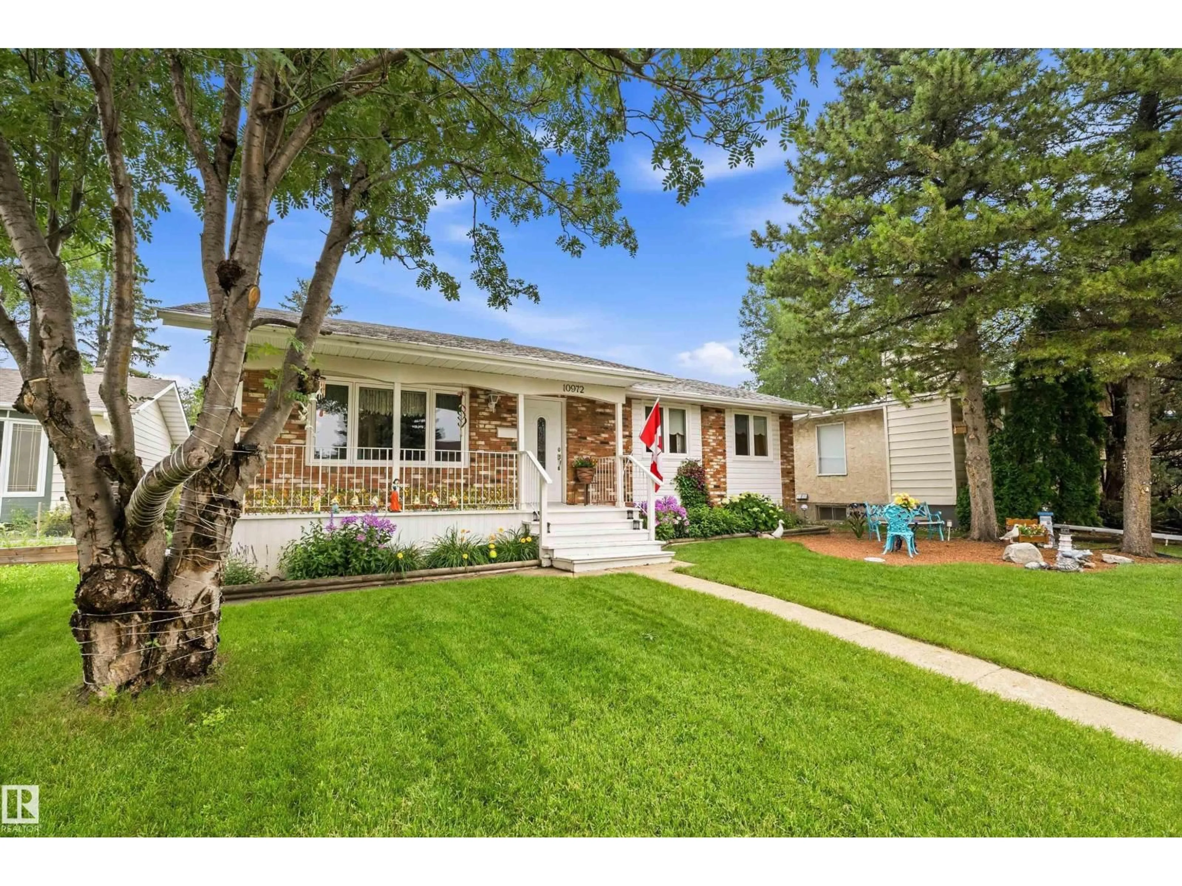 Home with vinyl exterior material, street for NW - 10972 35 AV, Edmonton Alberta T6J2V3