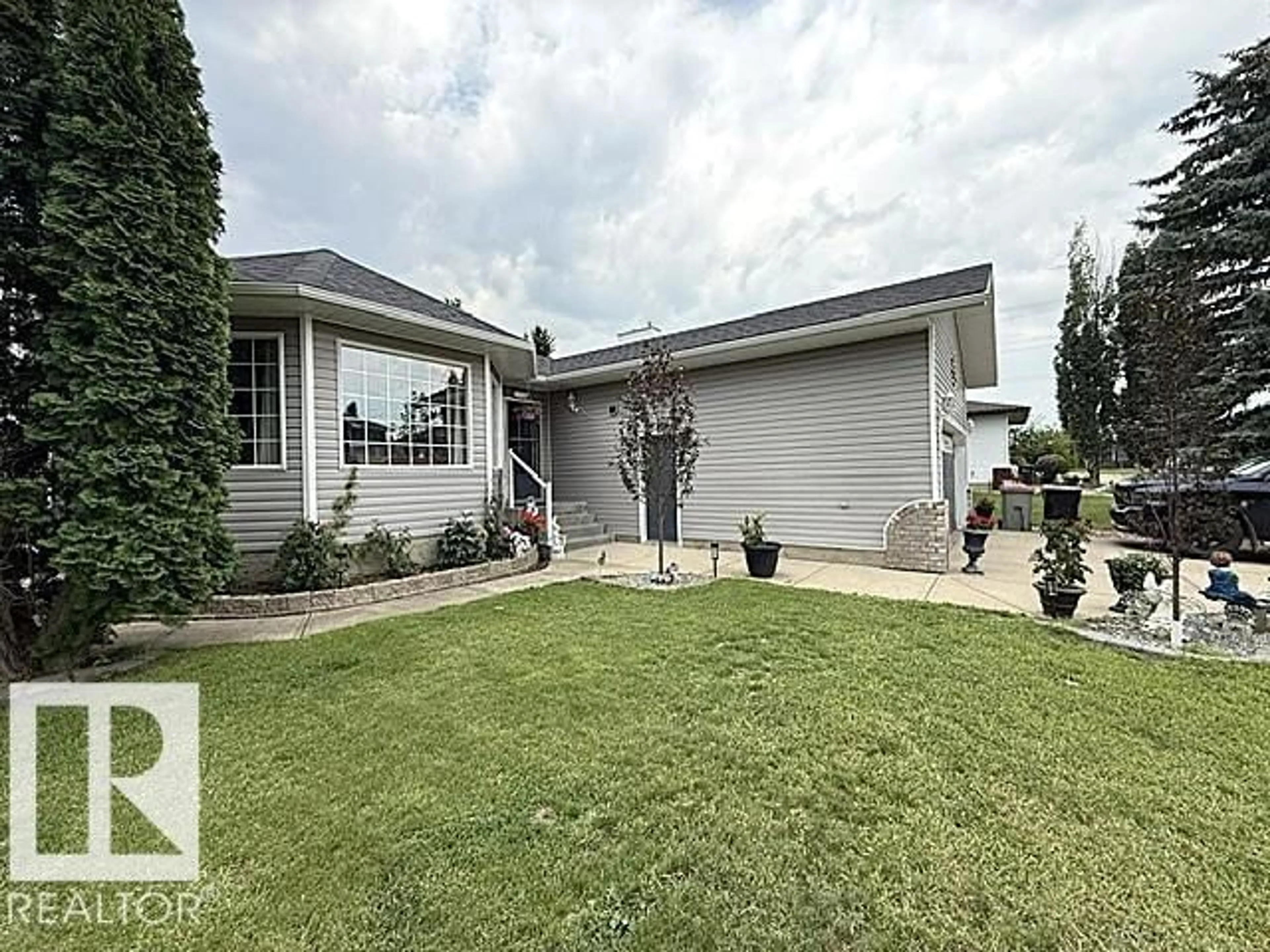Home with vinyl exterior material, street for 212 WEST LIBERTY CR, Millet Alberta T0C1Z0