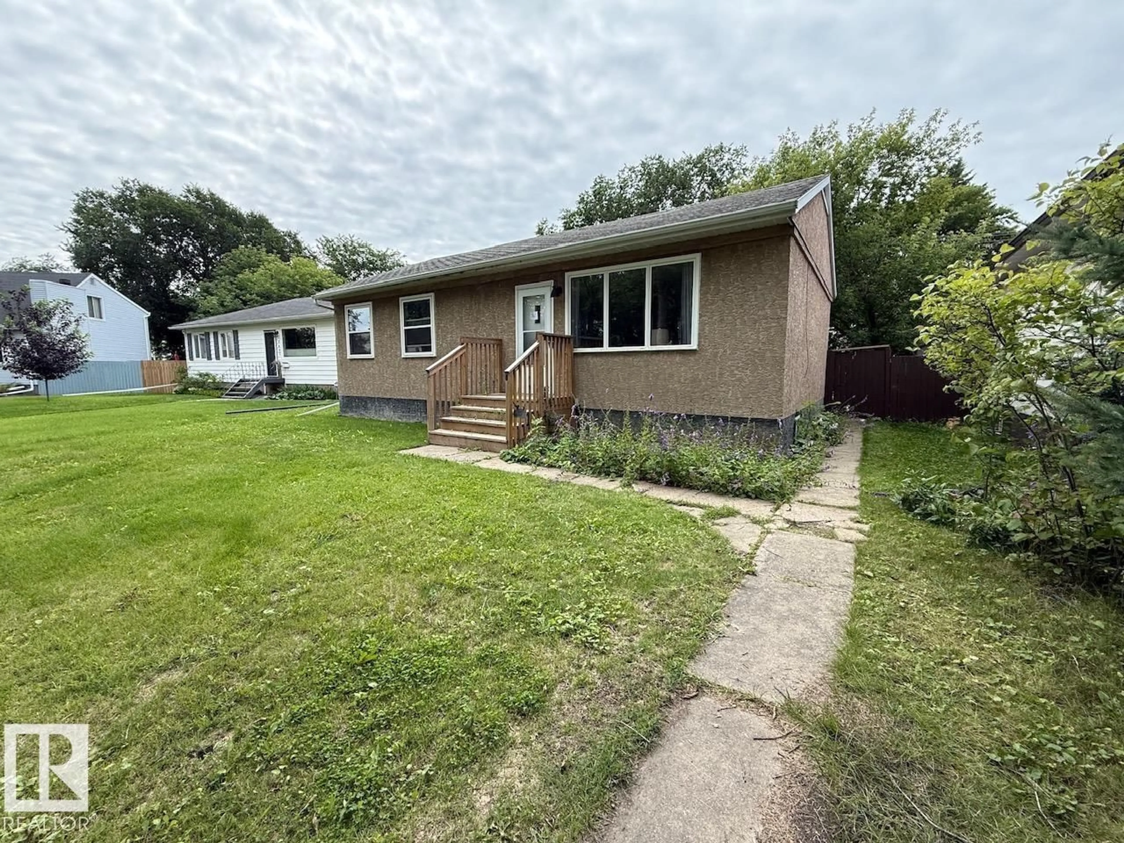 A pic from outside/outdoor area/front of a property/back of a property/a pic from drone, street for 7607 83 AV, Edmonton Alberta T6C1A2