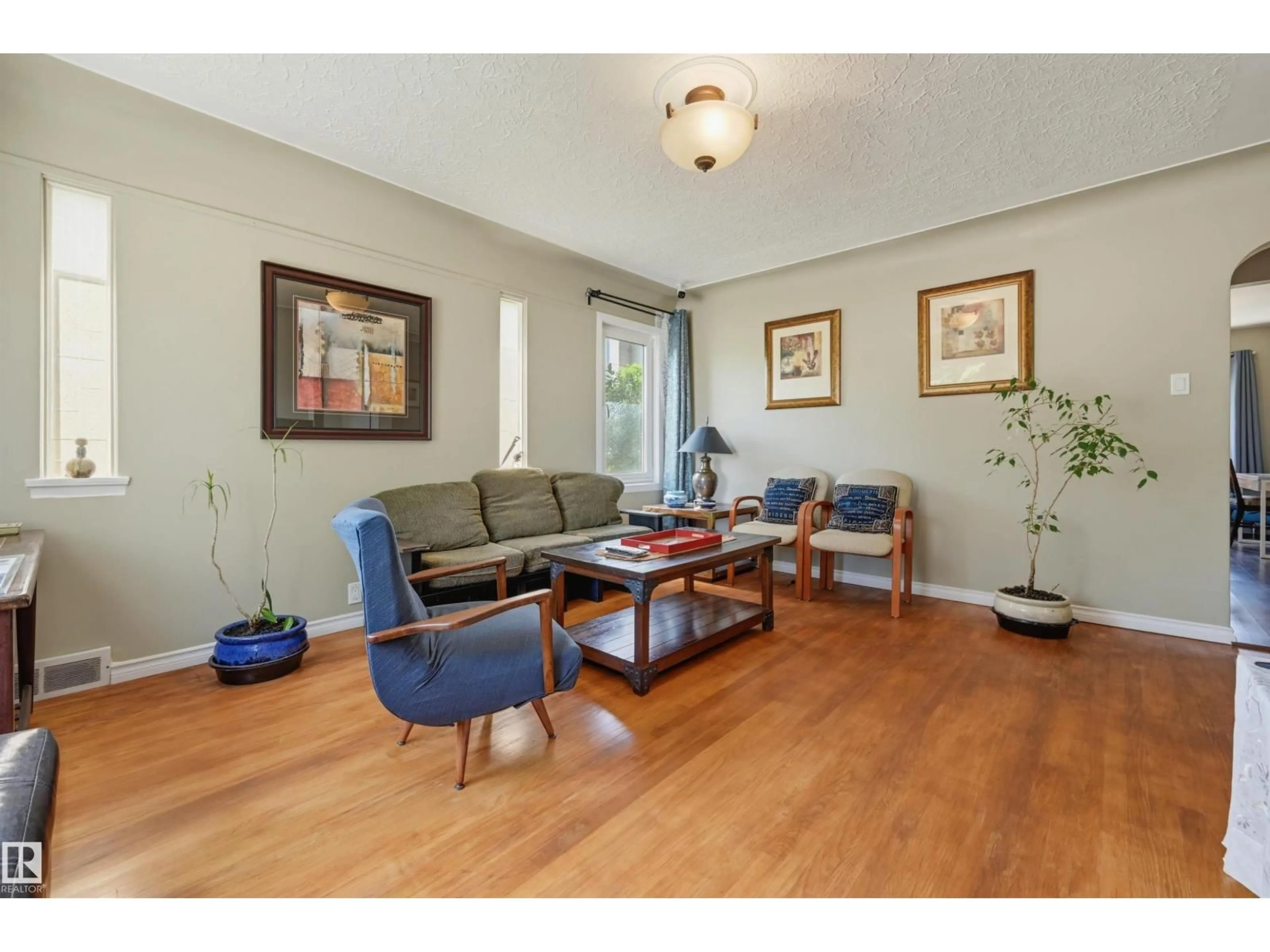 Living room with furniture, wood/laminate floor for NW - 11502 127 ST, Edmonton Alberta T5M0V3