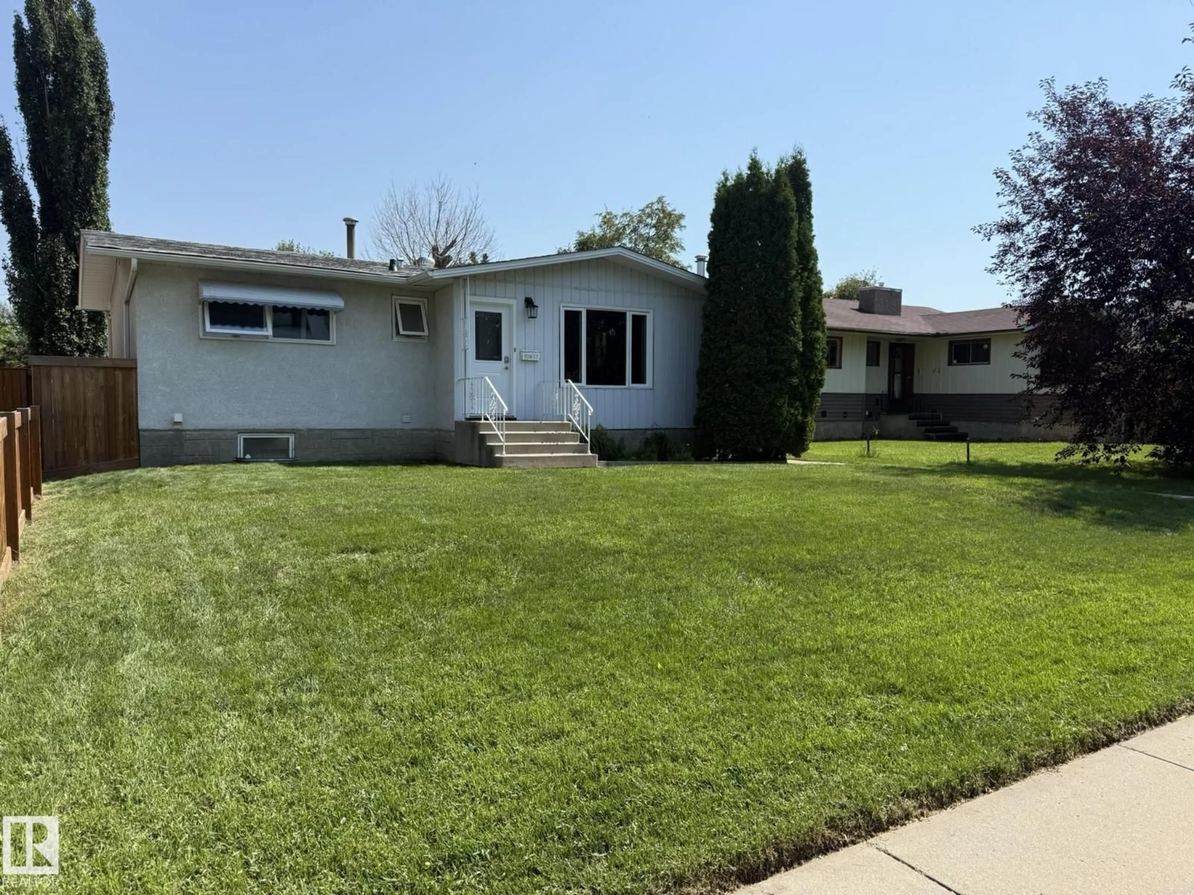 Home with vinyl exterior material, street for 10837 155 ST NW, Edmonton Alberta T5P2M9