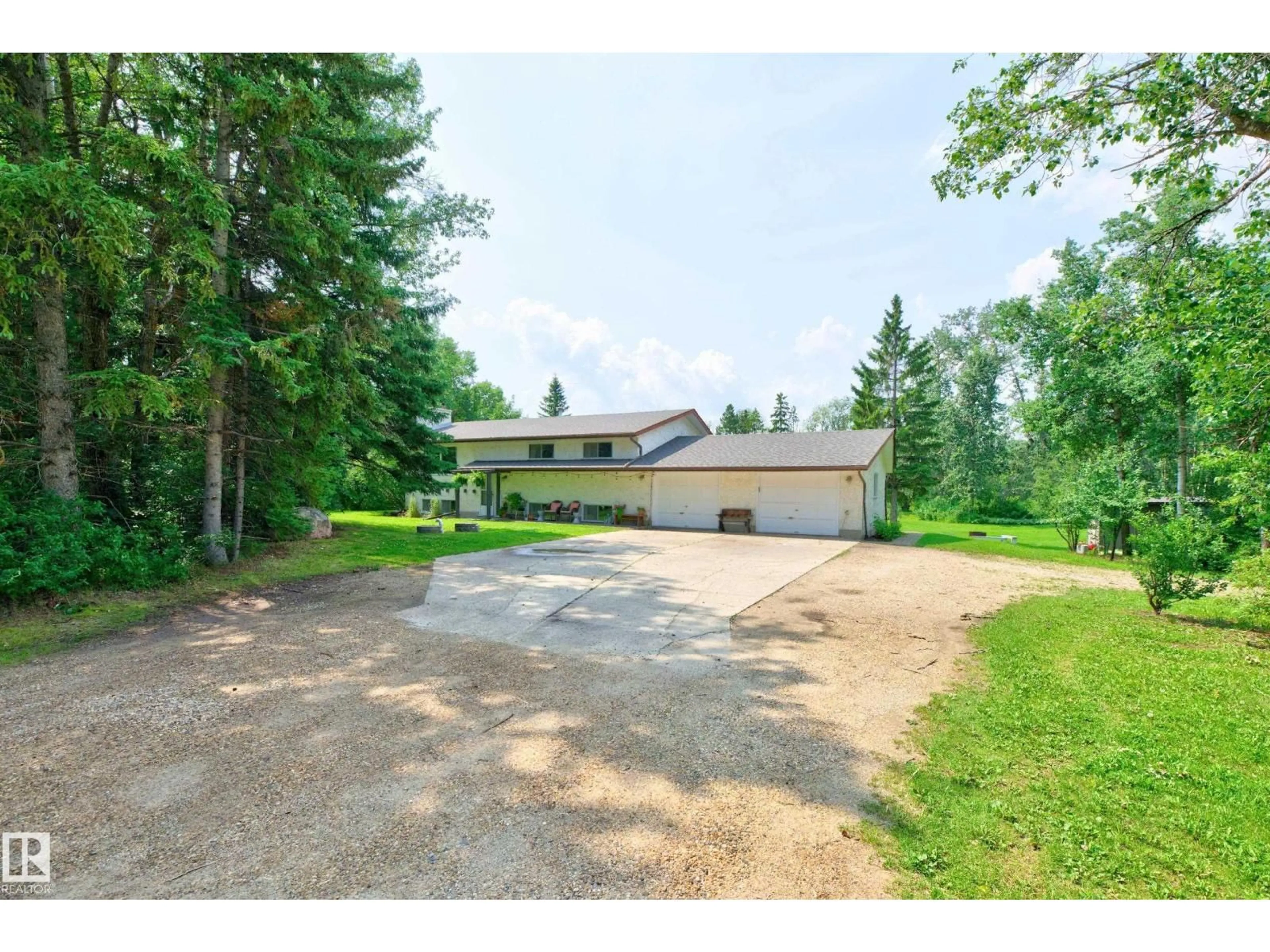 A pic from outside/outdoor area/front of a property/back of a property/a pic from drone, unknown for 218 - 52435 RGE ROAD 223 RGE ROAD, Rural Strathcona County Alberta T8A4P8