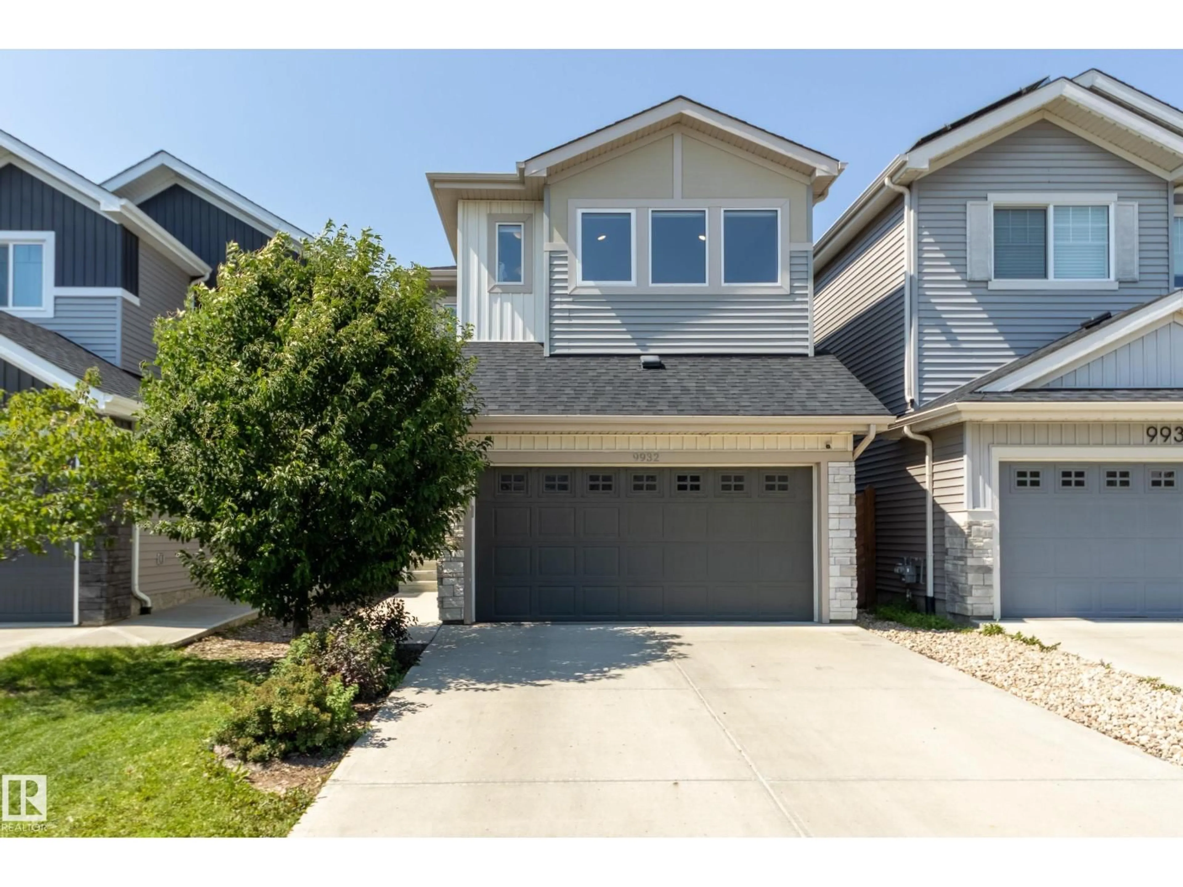 Home with vinyl exterior material, street for 9932 223 ST, Edmonton Alberta T5T7L7