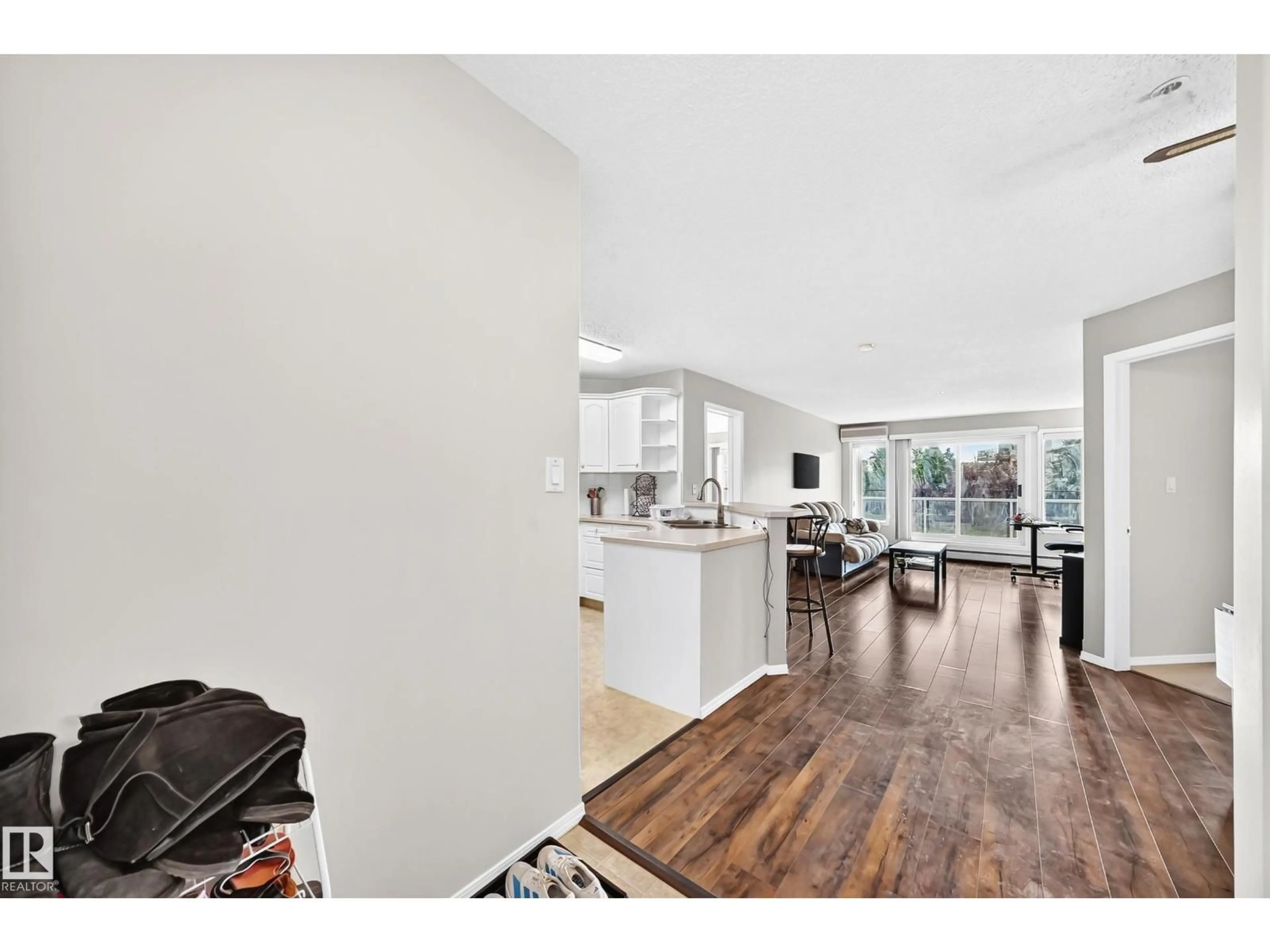 Open concept kitchen, wood/laminate floor for #201 - 9760 174 ST, Edmonton Alberta T5T6J4