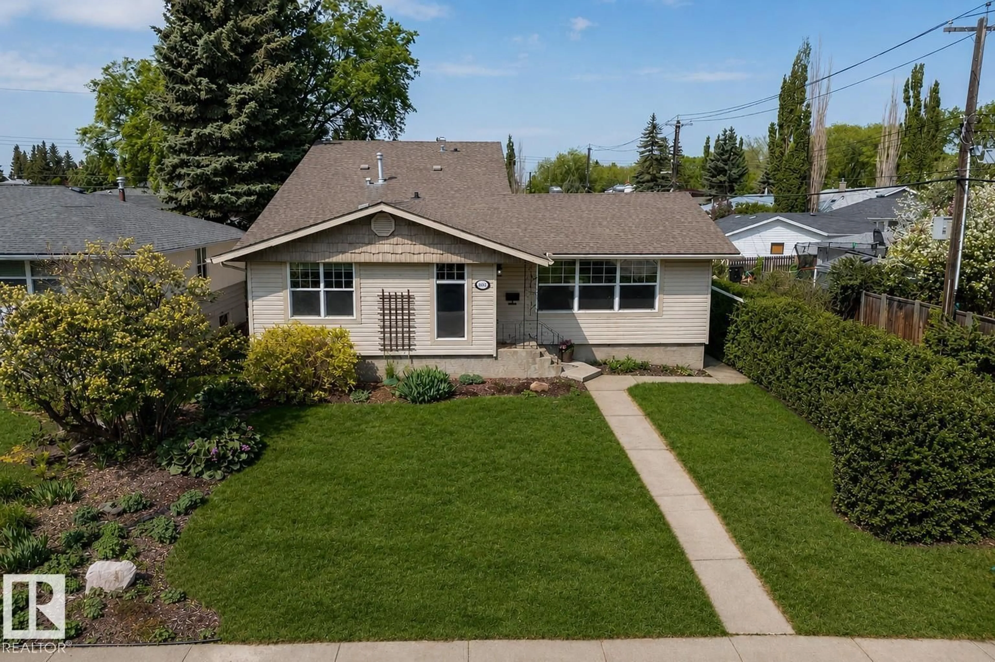 Home with vinyl exterior material, street for 9036 145 ST, Edmonton Alberta T5R0V2