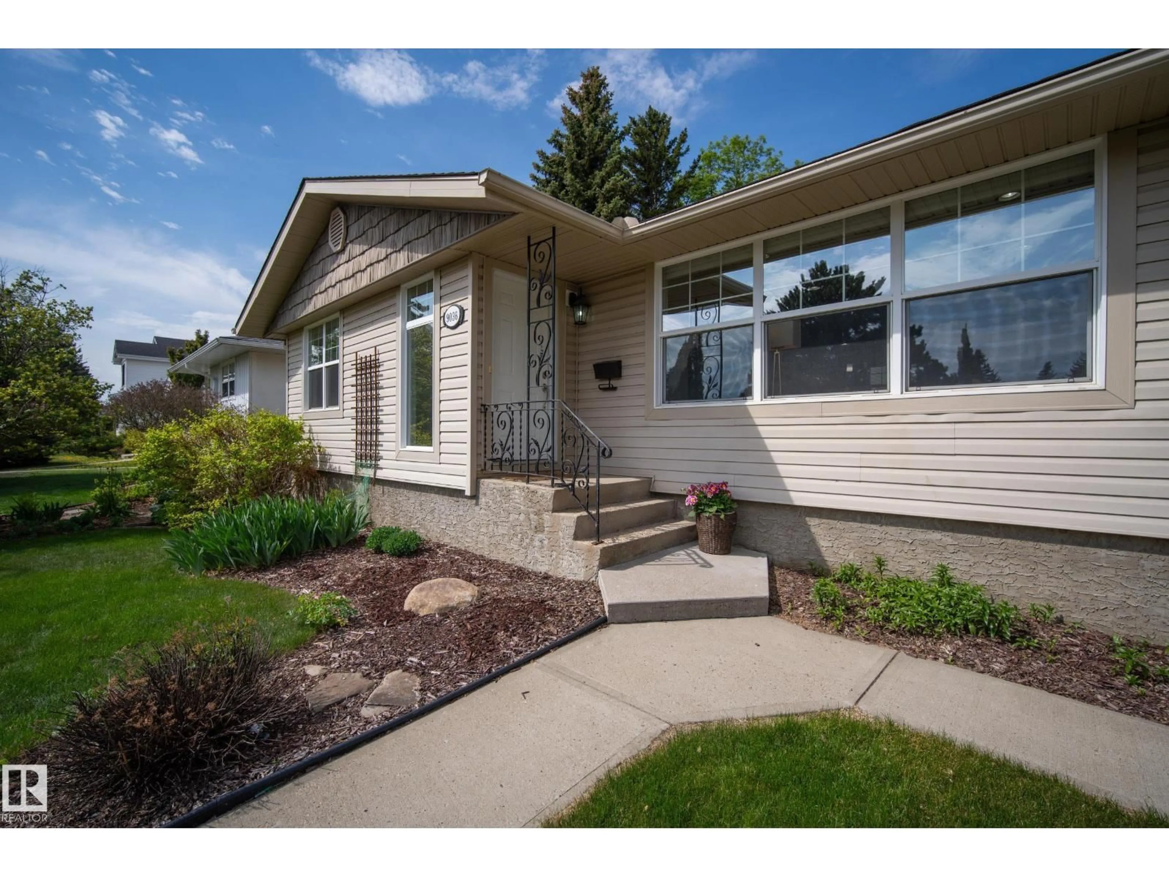 Home with vinyl exterior material, street for 9036 145 ST, Edmonton Alberta T5R0V2