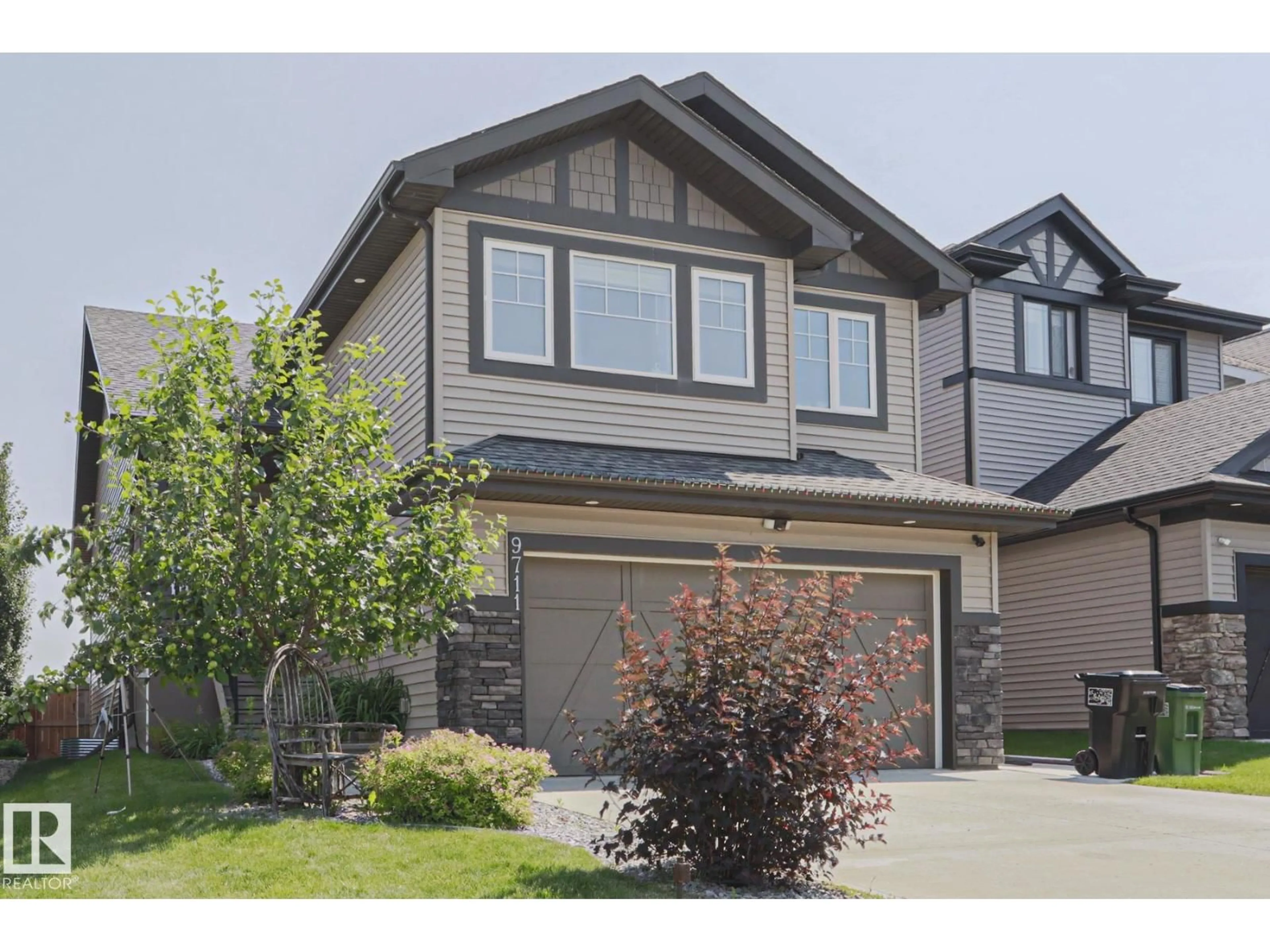 Home with vinyl exterior material, street for NW - 9711 223 ST, Edmonton Alberta T5T7B7