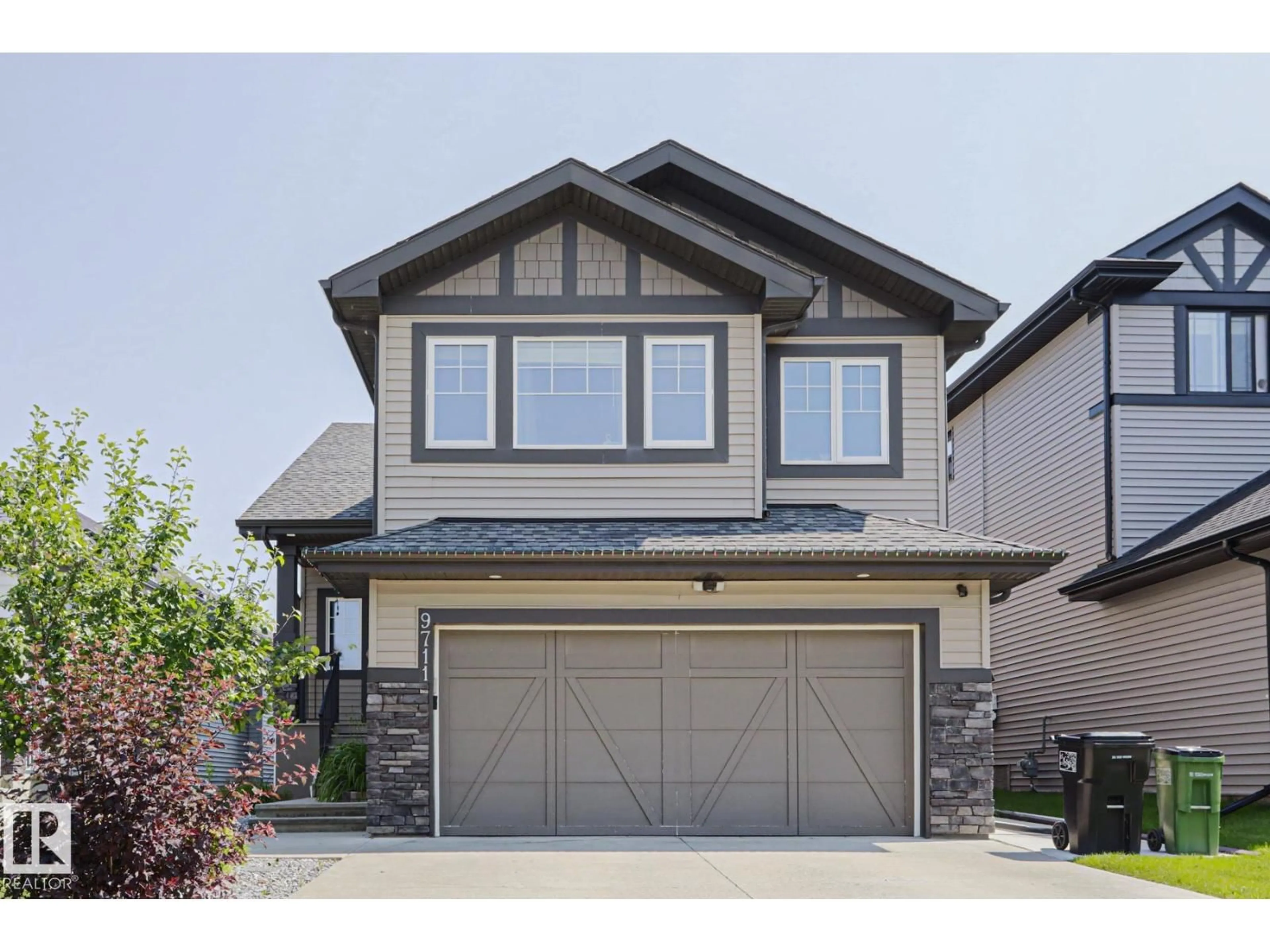 Home with vinyl exterior material, street for NW - 9711 223 ST, Edmonton Alberta T5T7B7