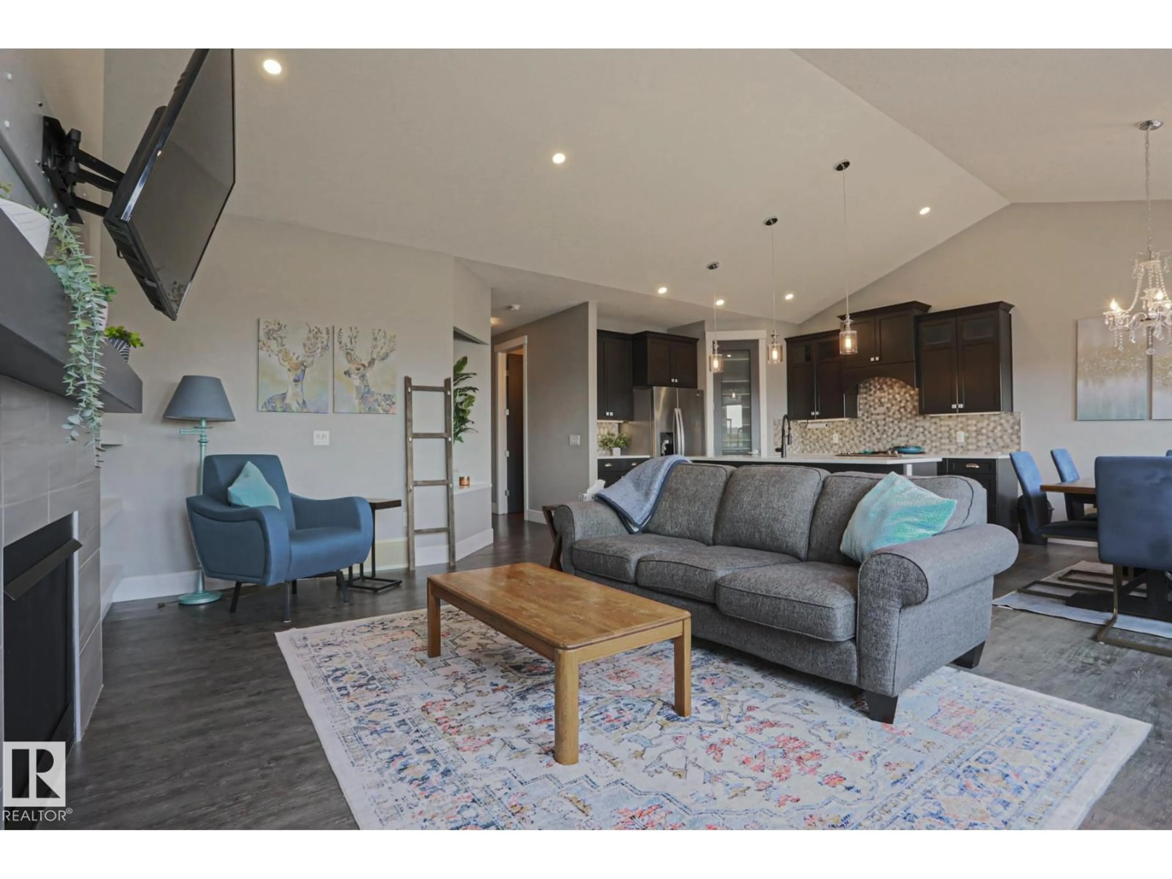 Living room with furniture, wood/laminate floor for NW - 9711 223 ST, Edmonton Alberta T5T7B7