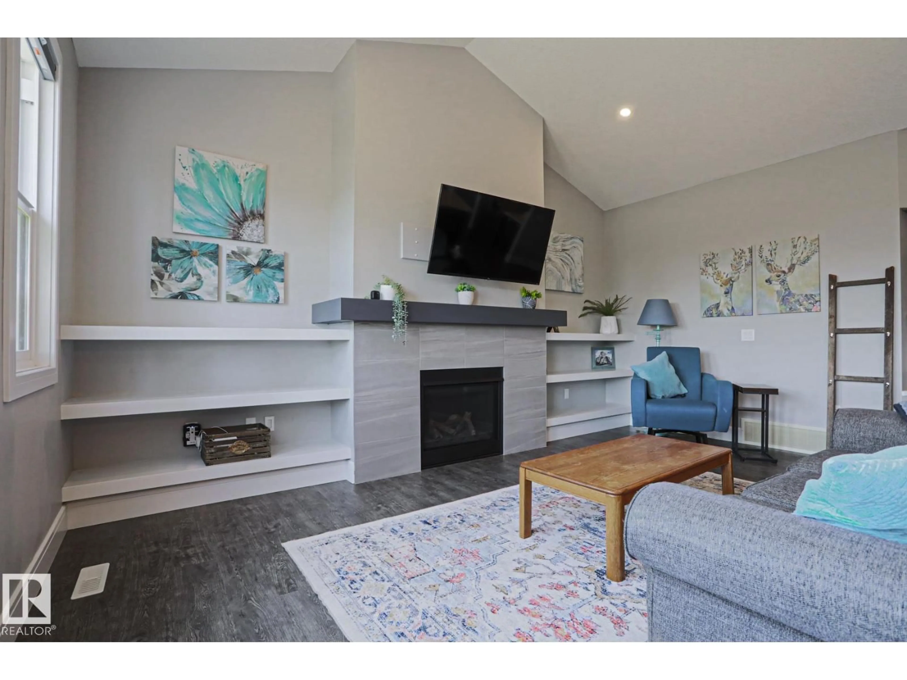 Living room with furniture, wood/laminate floor for NW - 9711 223 ST, Edmonton Alberta T5T7B7