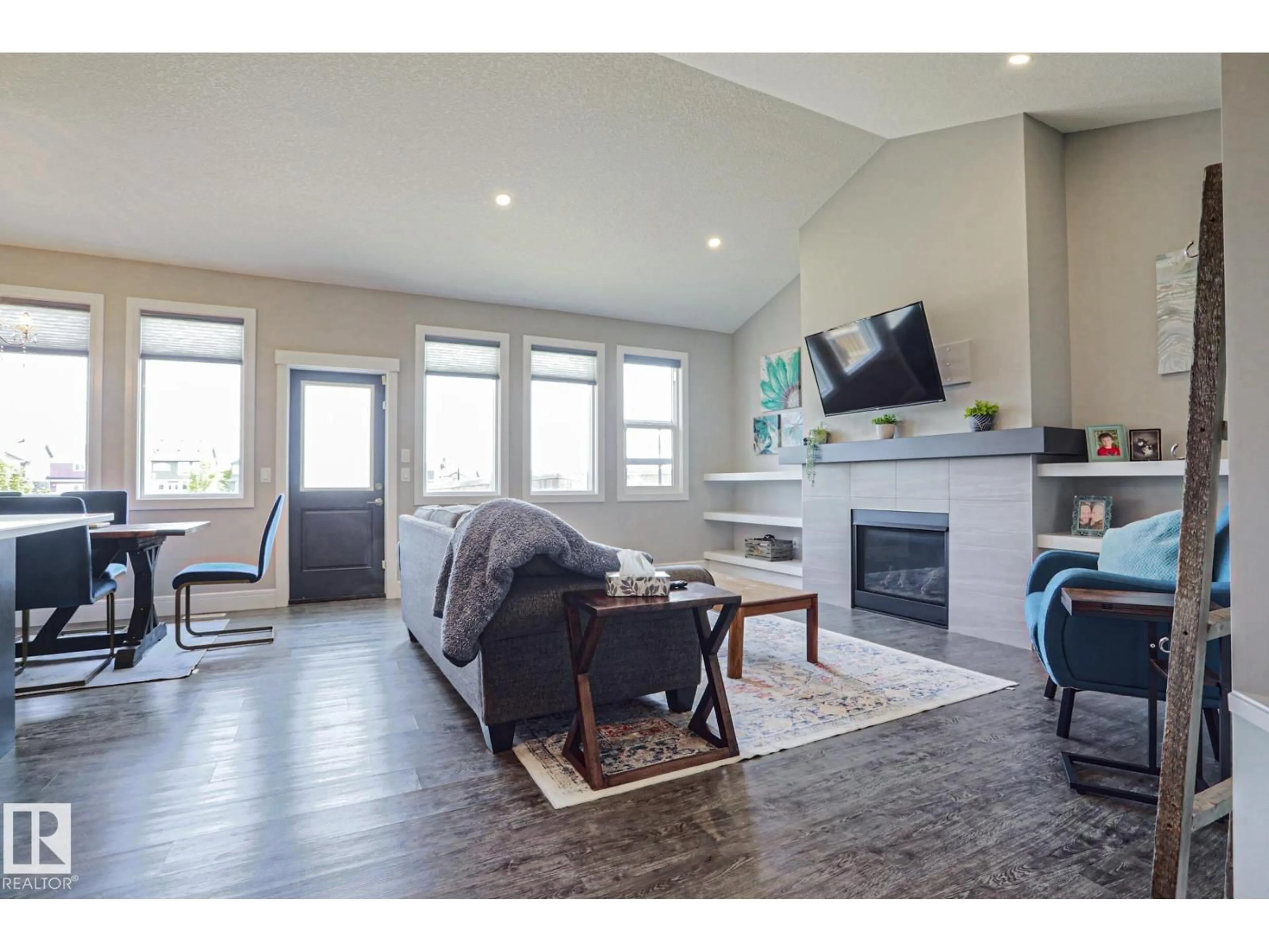 Living room with furniture, wood/laminate floor for NW - 9711 223 ST, Edmonton Alberta T5T7B7