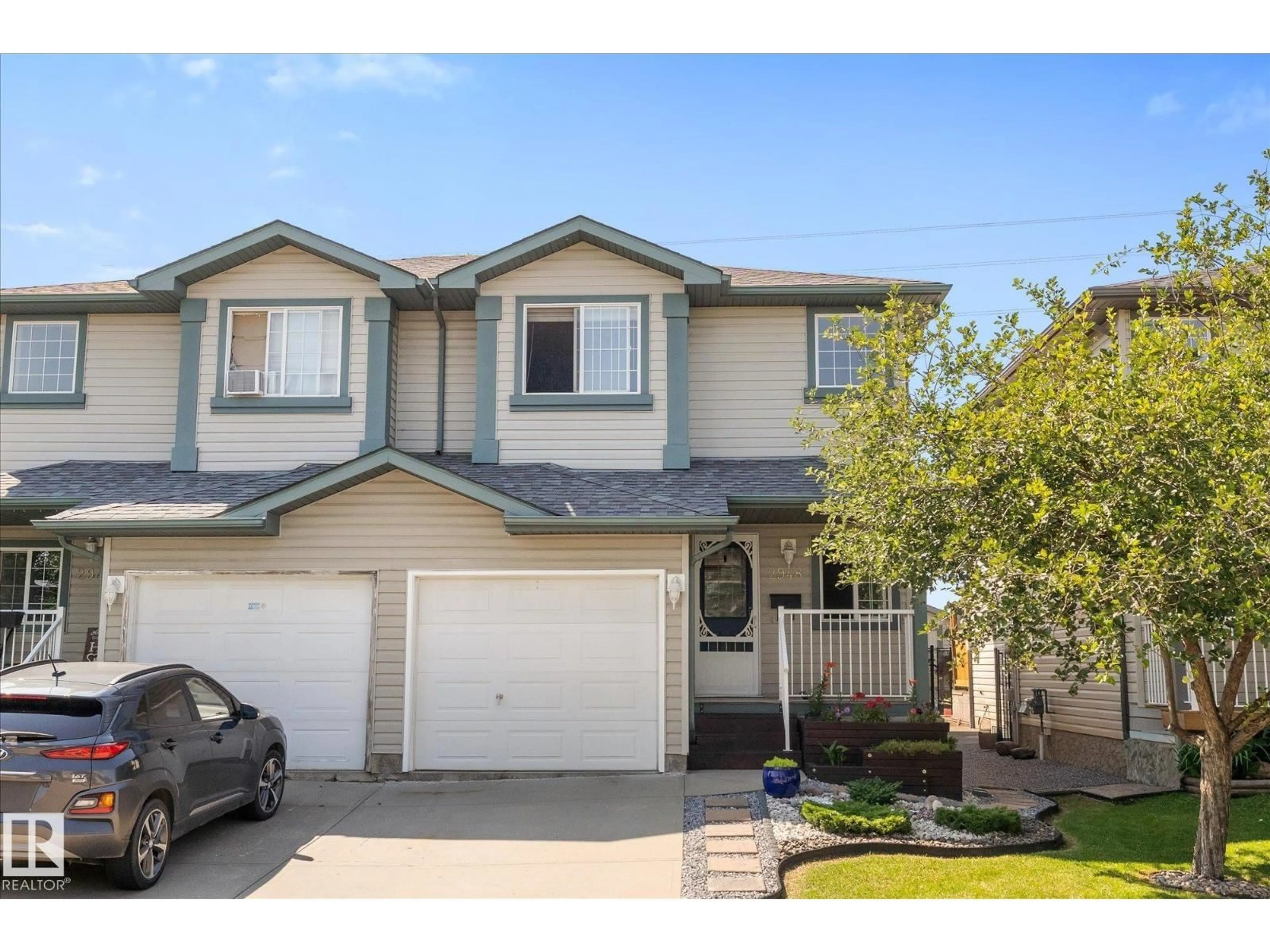 Home with vinyl exterior material, street for 2948 26 ST, Edmonton Alberta T6T2A1
