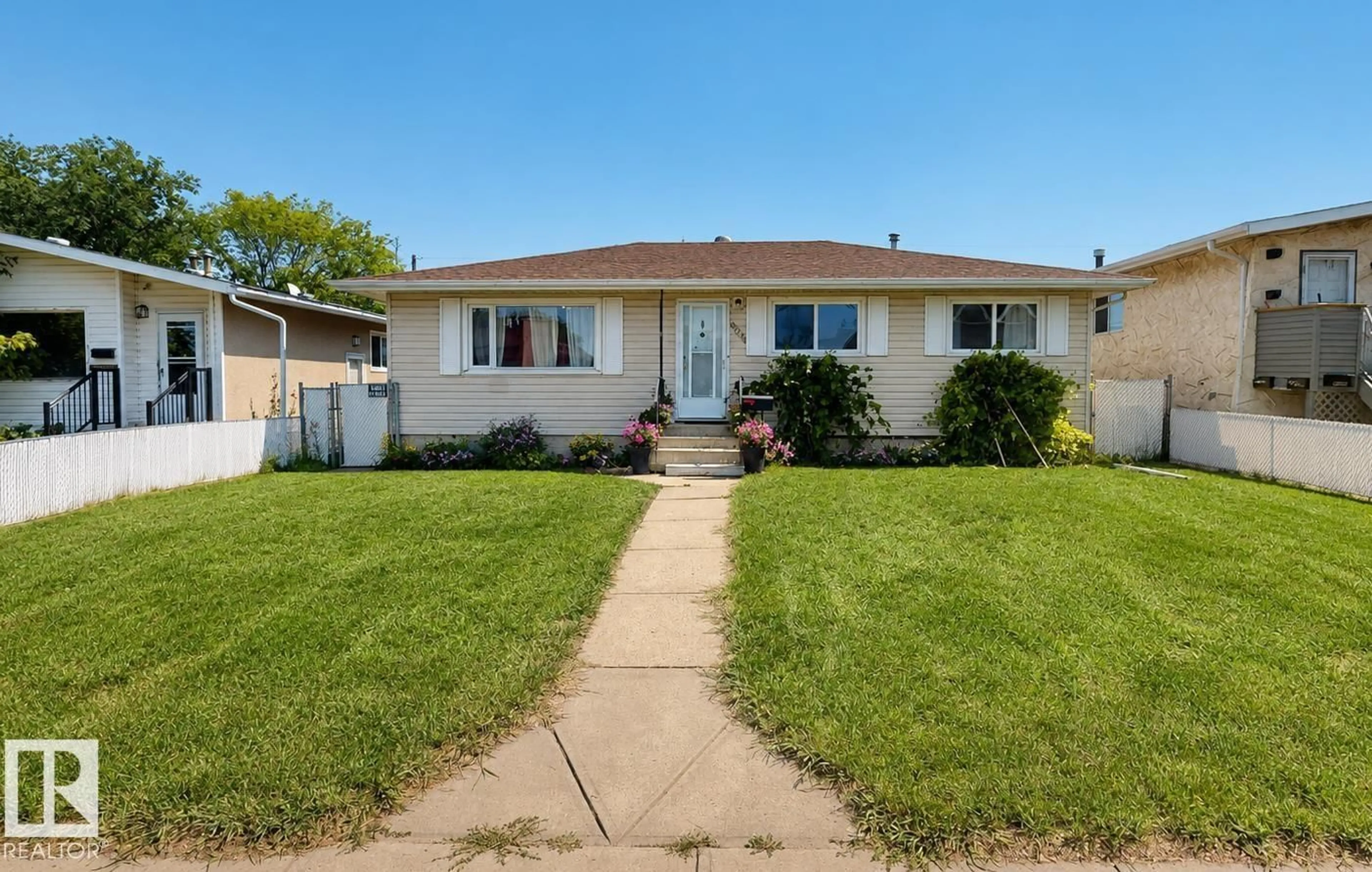 Home with vinyl exterior material, street for NW - 10661 152 ST, Edmonton Alberta T5P1Z1