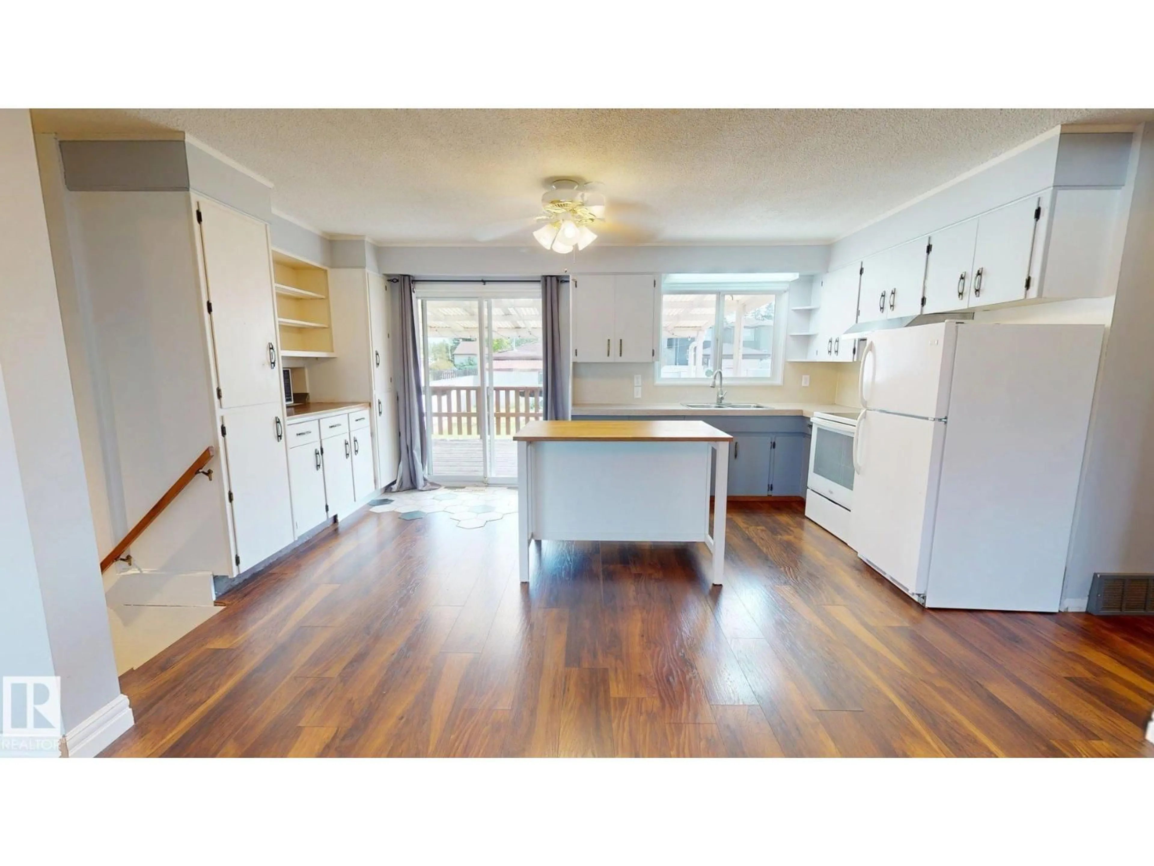 Open concept kitchen, wood/laminate floor for NW - 10661 152 ST, Edmonton Alberta T5P1Z1