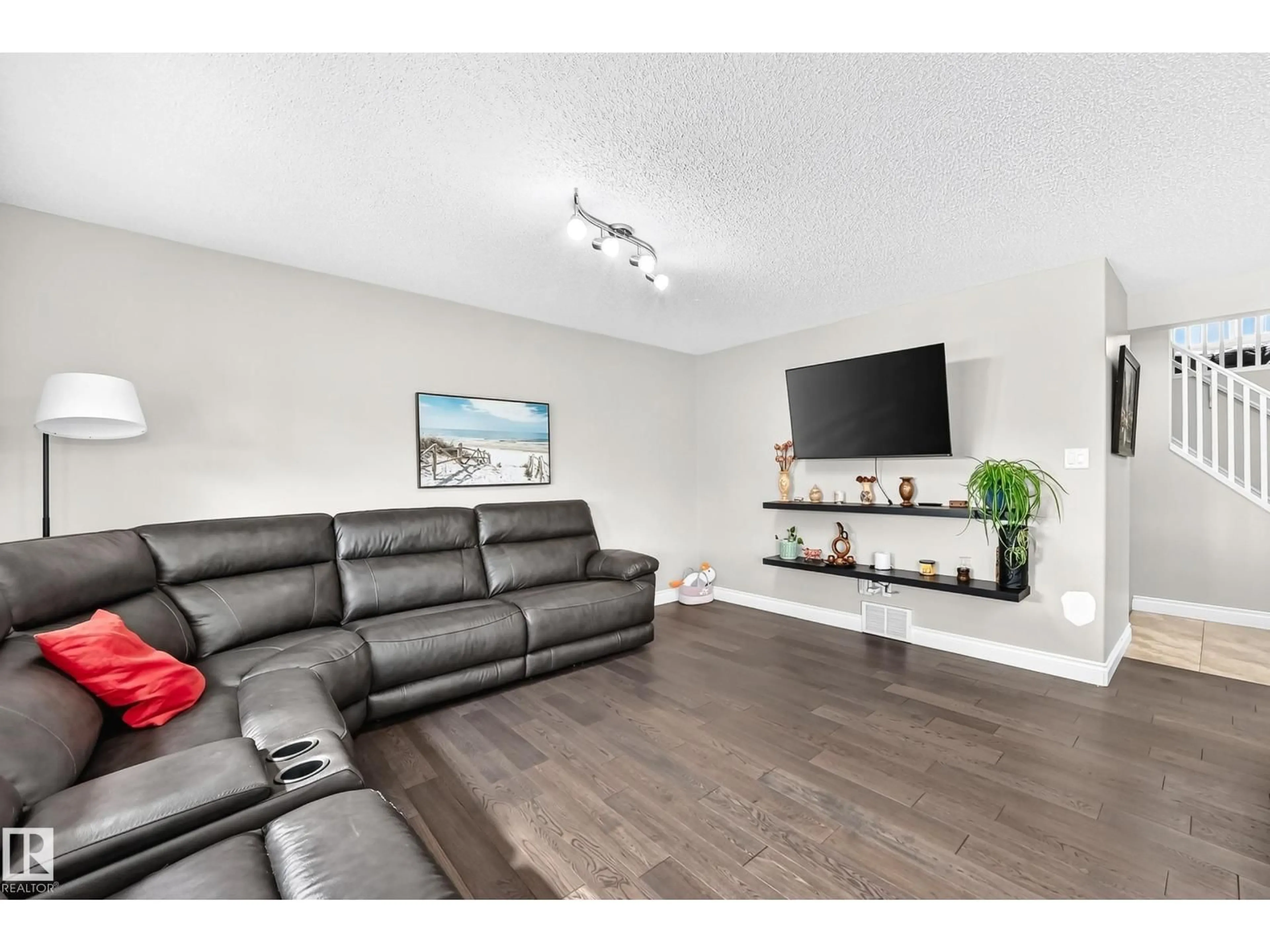 Living room with furniture, wood/laminate floor for NW - 17803 89 ST, Edmonton Alberta T5Z0A6