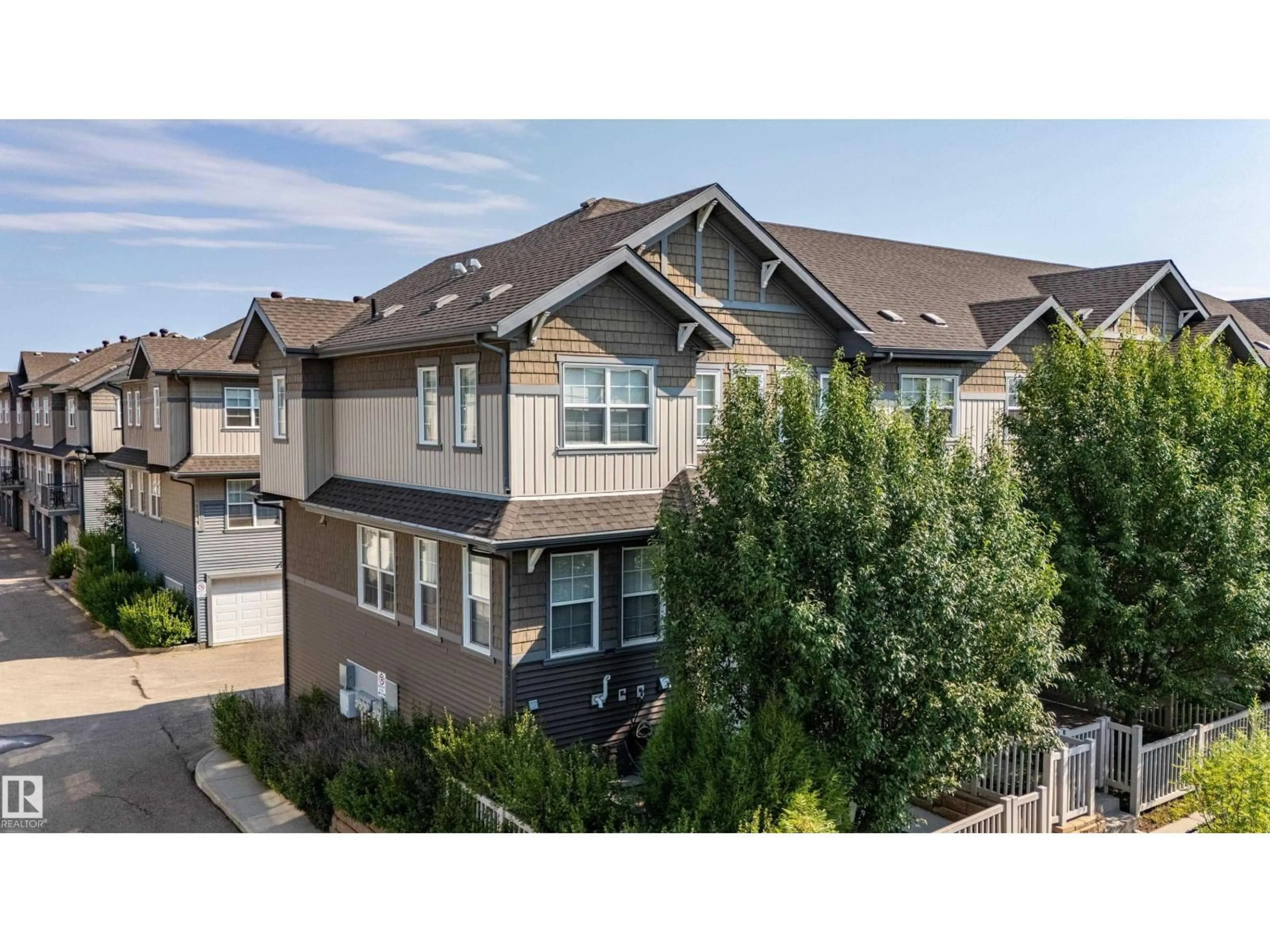A pic from outside/outdoor area/front of a property/back of a property/a pic from drone, mountain view for #54 - 4029 ORCHARDS DR, Edmonton Alberta T6X1V2