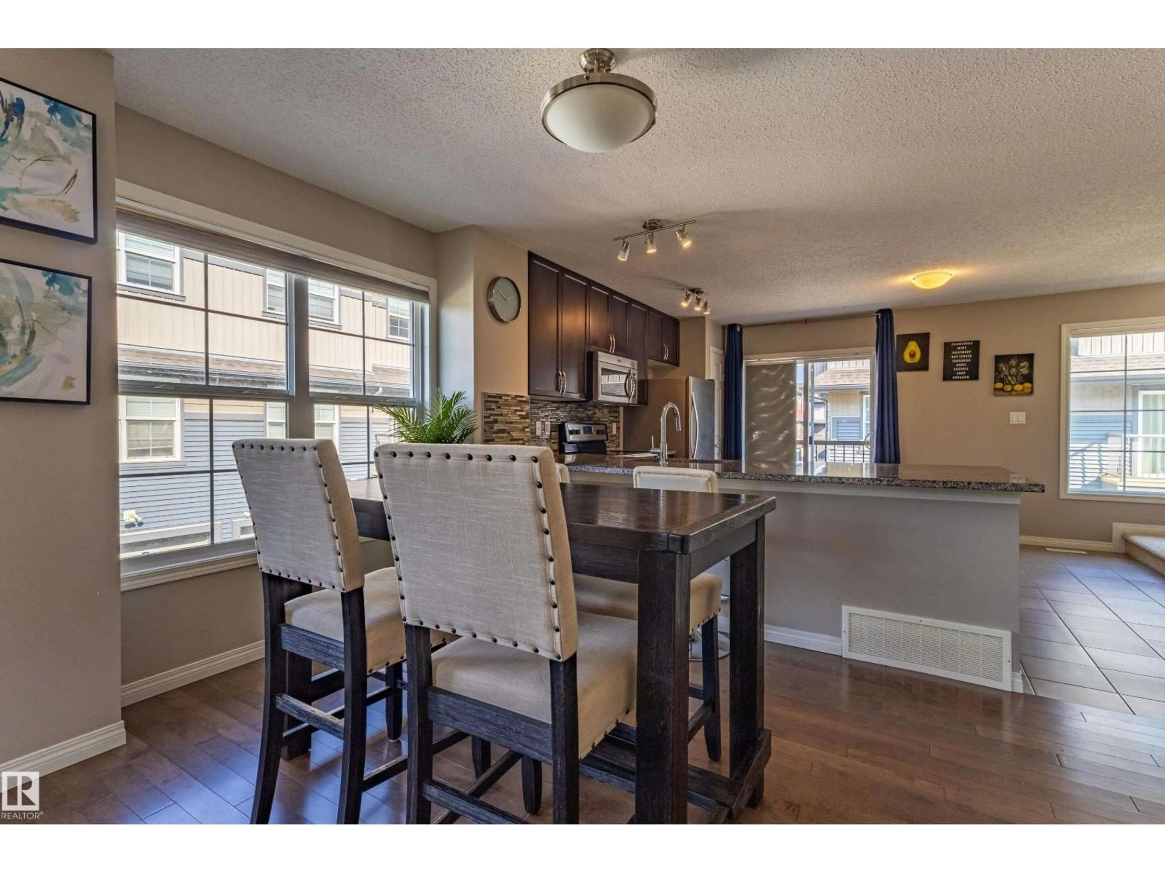 Open concept kitchen, wood/laminate floor for #54 - 4029 ORCHARDS DR, Edmonton Alberta T6X1V2