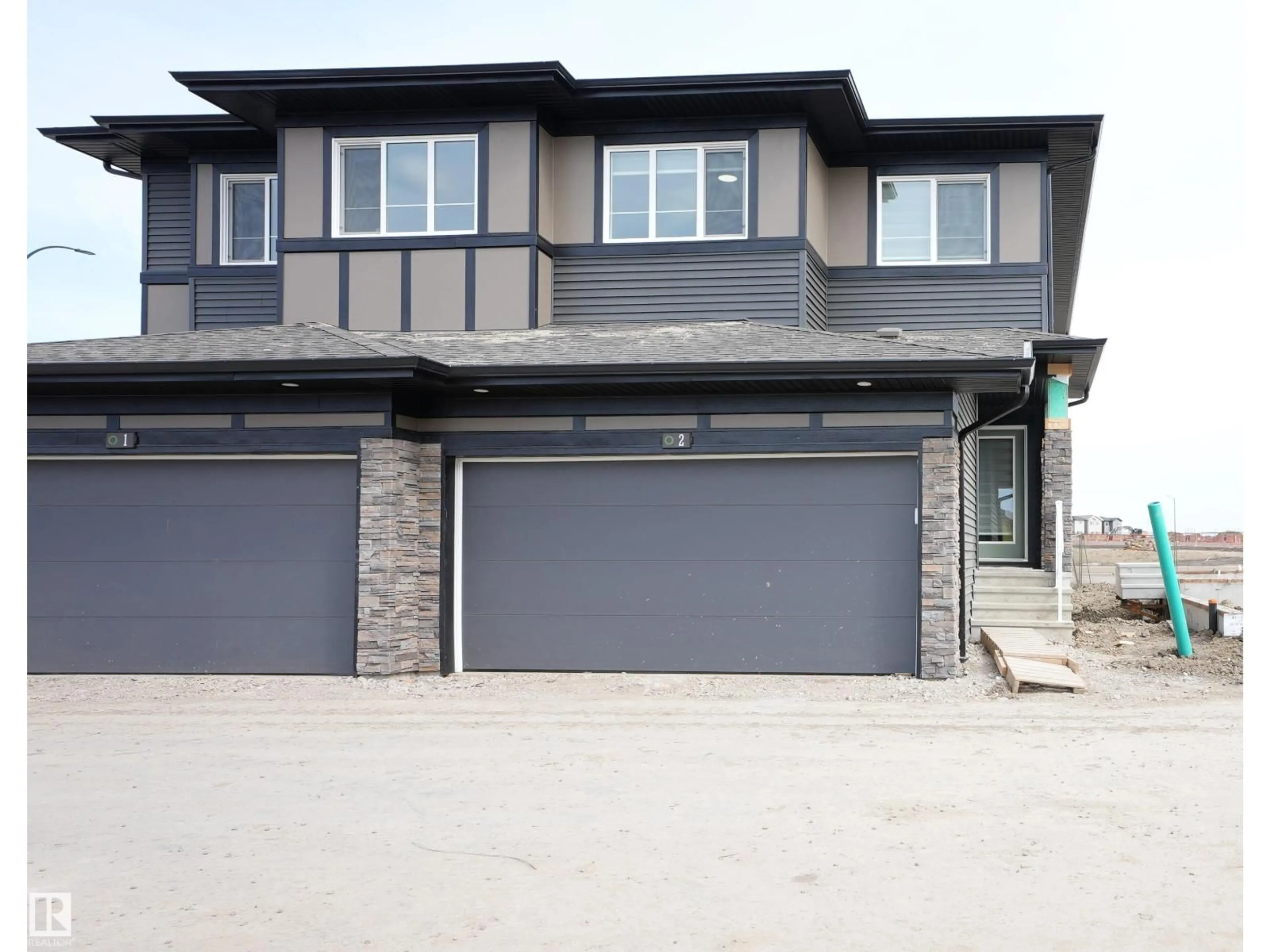 Home with vinyl exterior material, street for #2 - 2710 66 ST, Edmonton Alberta T6X3H4