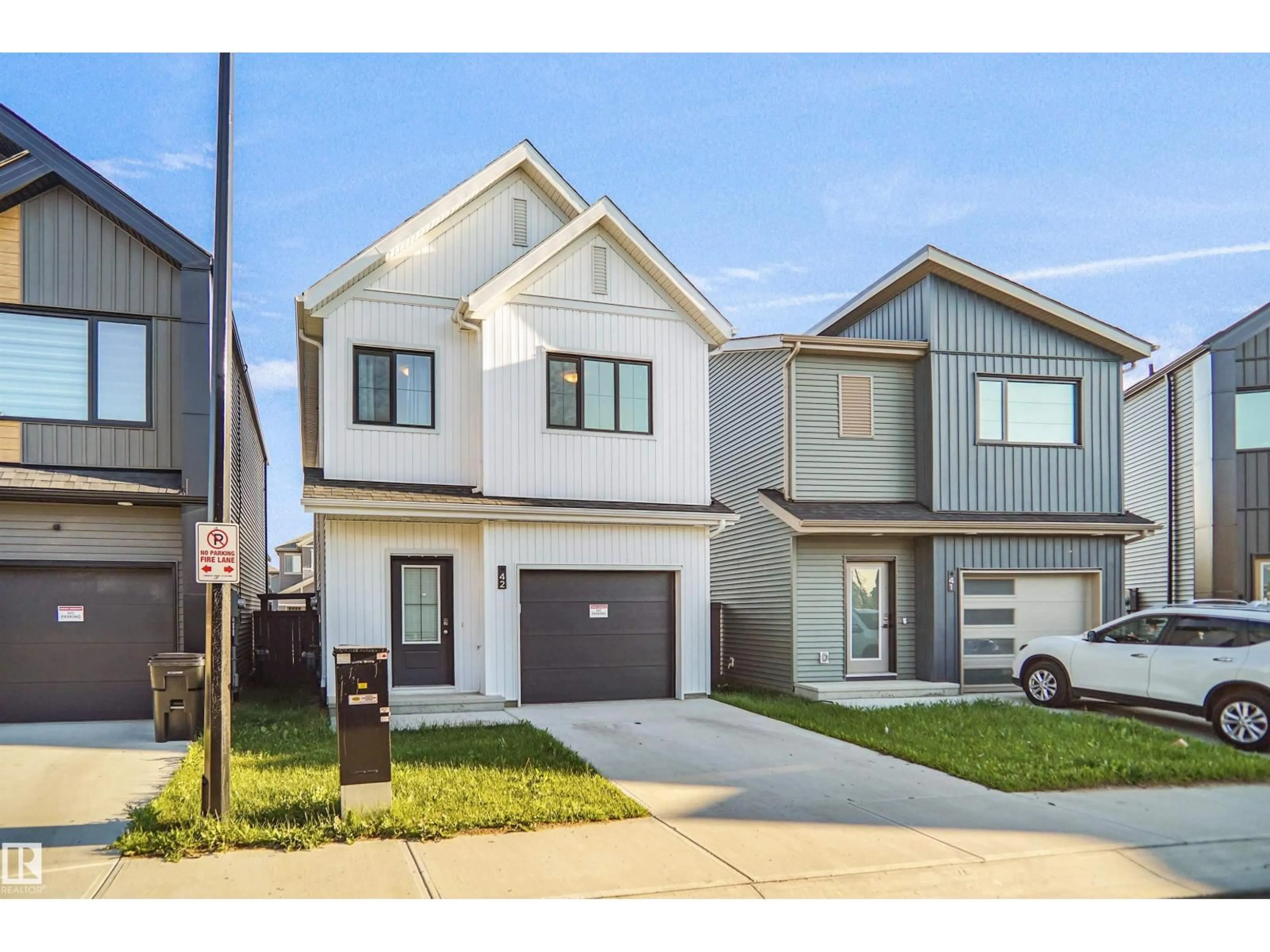 Home with vinyl exterior material, street for #42 - 19904 31 AV, Edmonton Alberta T6M3B9