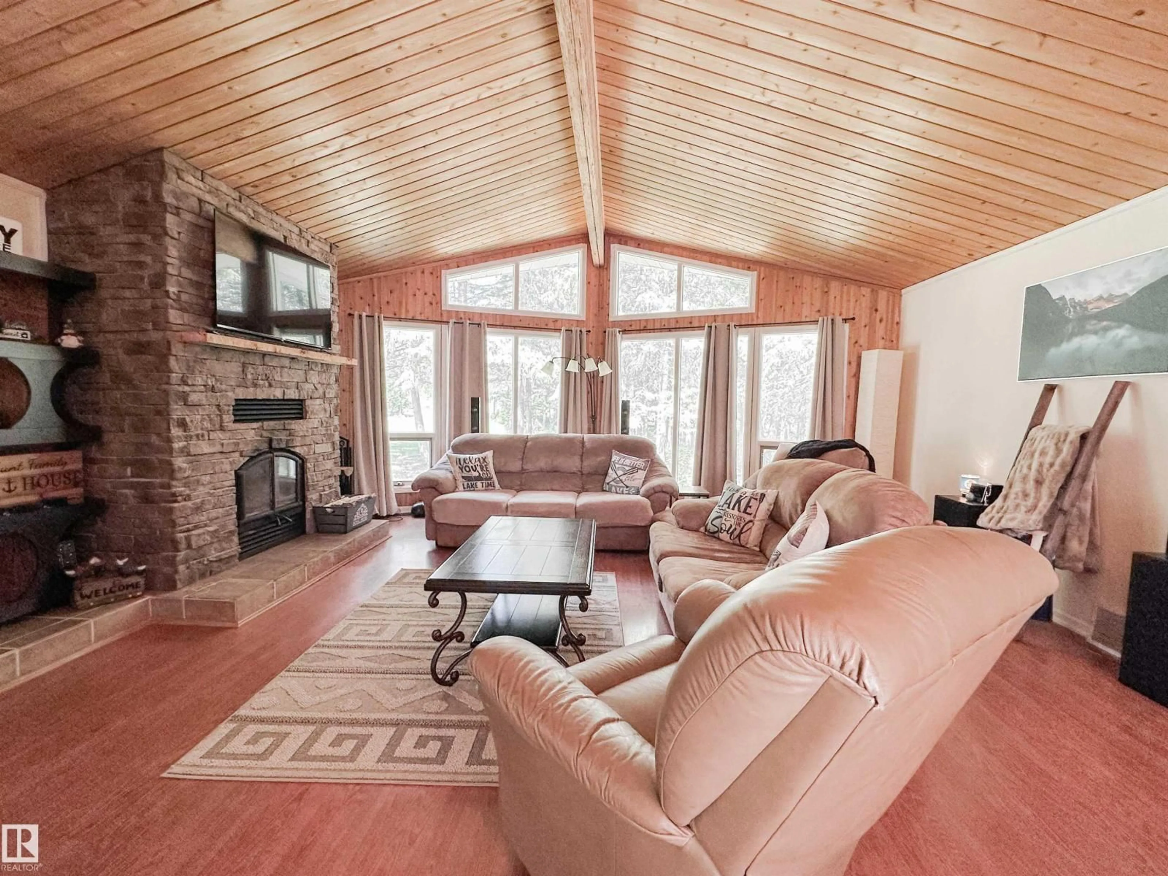 Living room with furniture, wood/laminate floor for 183049 - 119 HWY 663, Rural Athabasca County Alberta T0A0M0