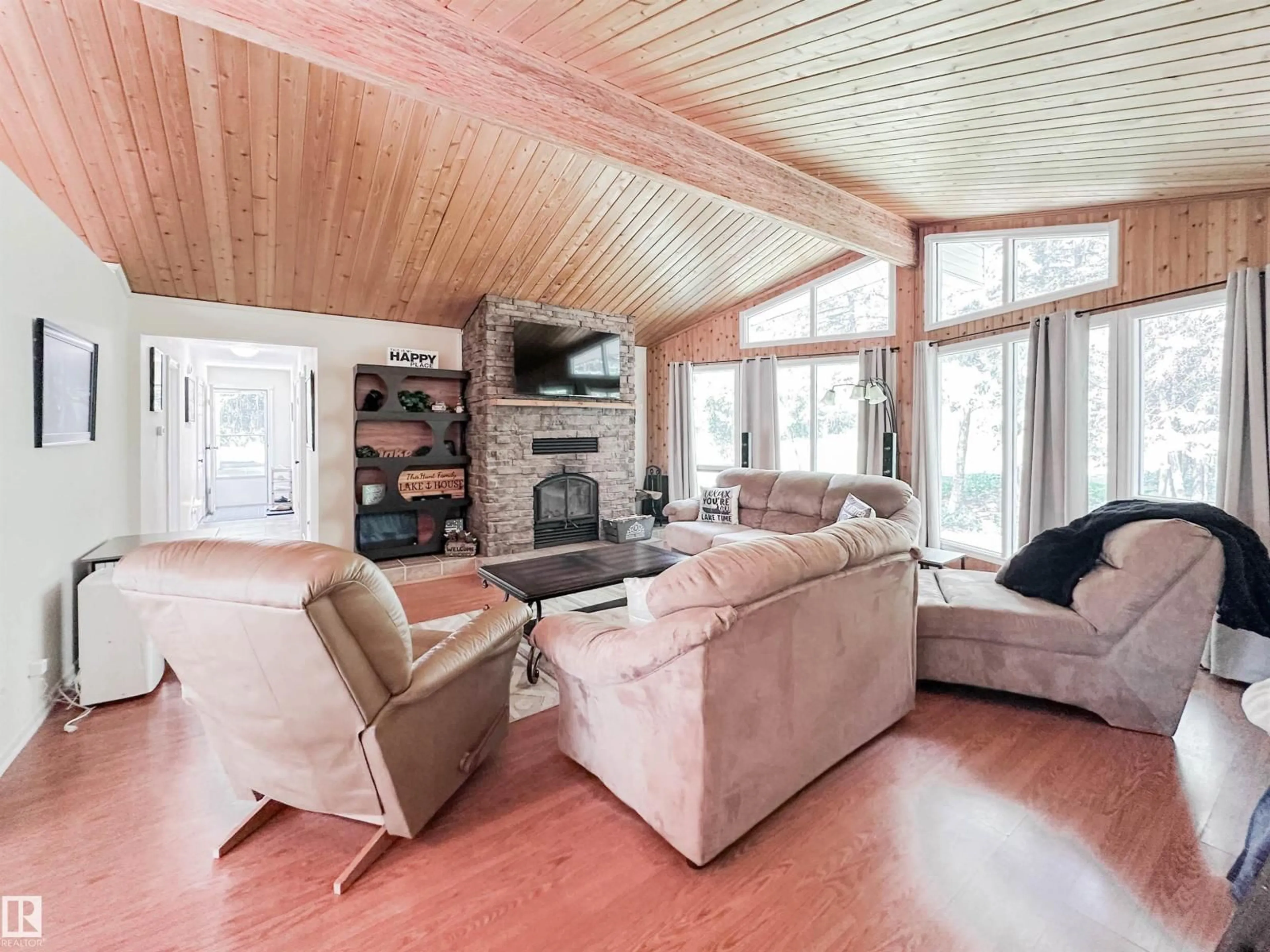 Living room with furniture, wood/laminate floor for 183049 - 119 HWY 663, Rural Athabasca County Alberta T0A0M0
