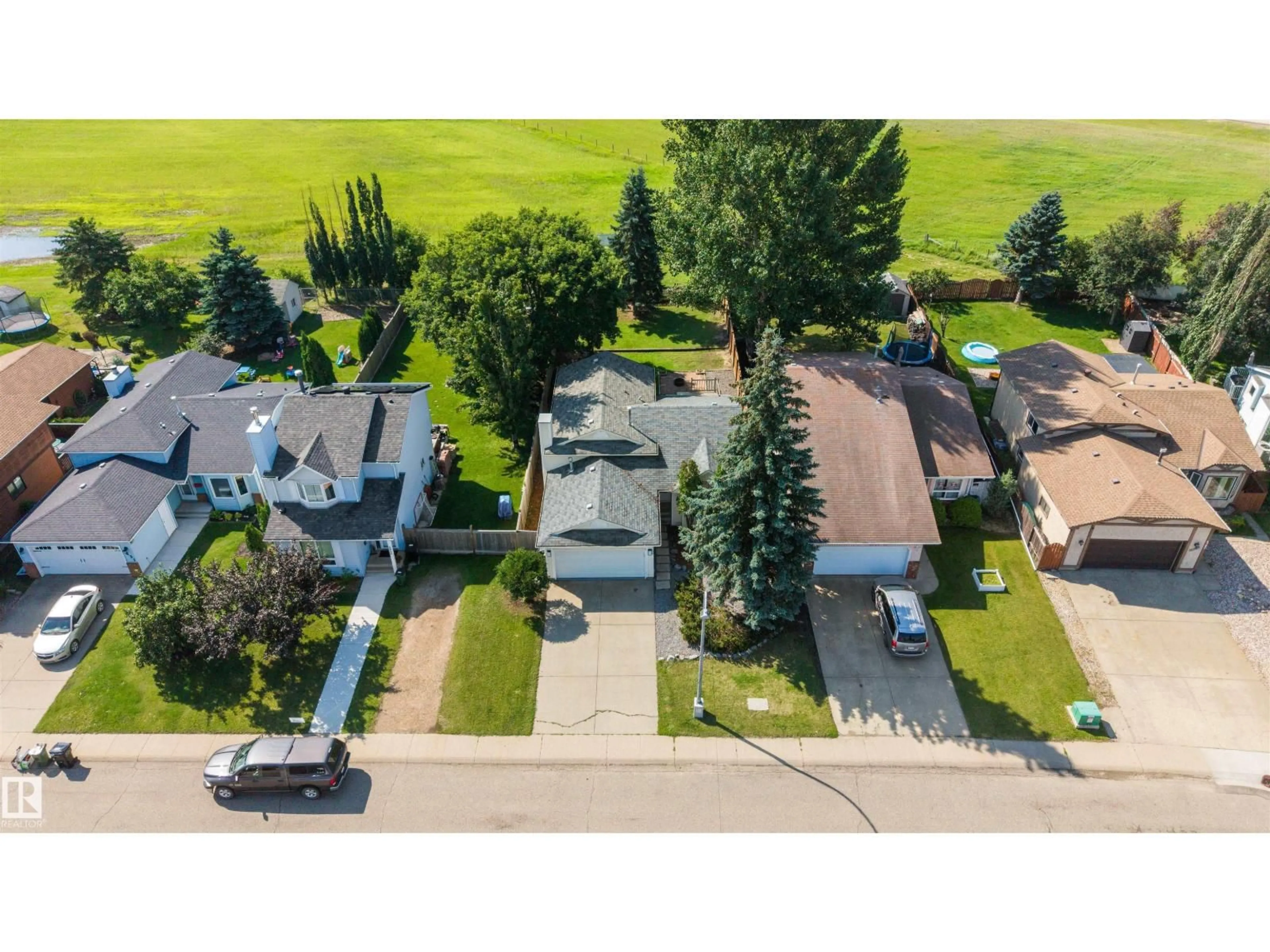 A pic from outside/outdoor area/front of a property/back of a property/a pic from drone, street for 4639 10 AV, Edmonton Alberta T6L4S2