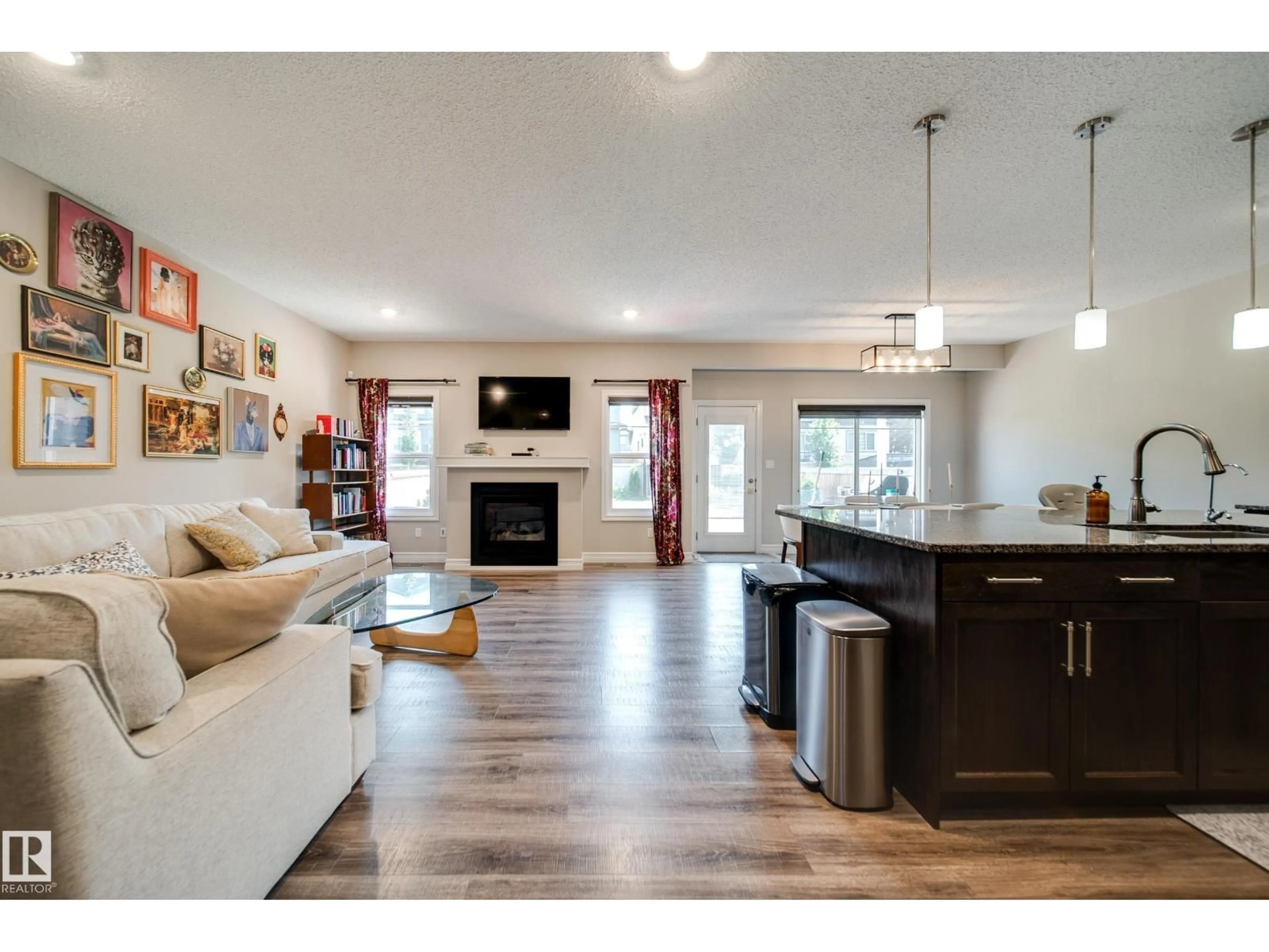Open concept kitchen, wood/laminate floor for 3632 KESWICK BV, Edmonton Alberta T6W3S5
