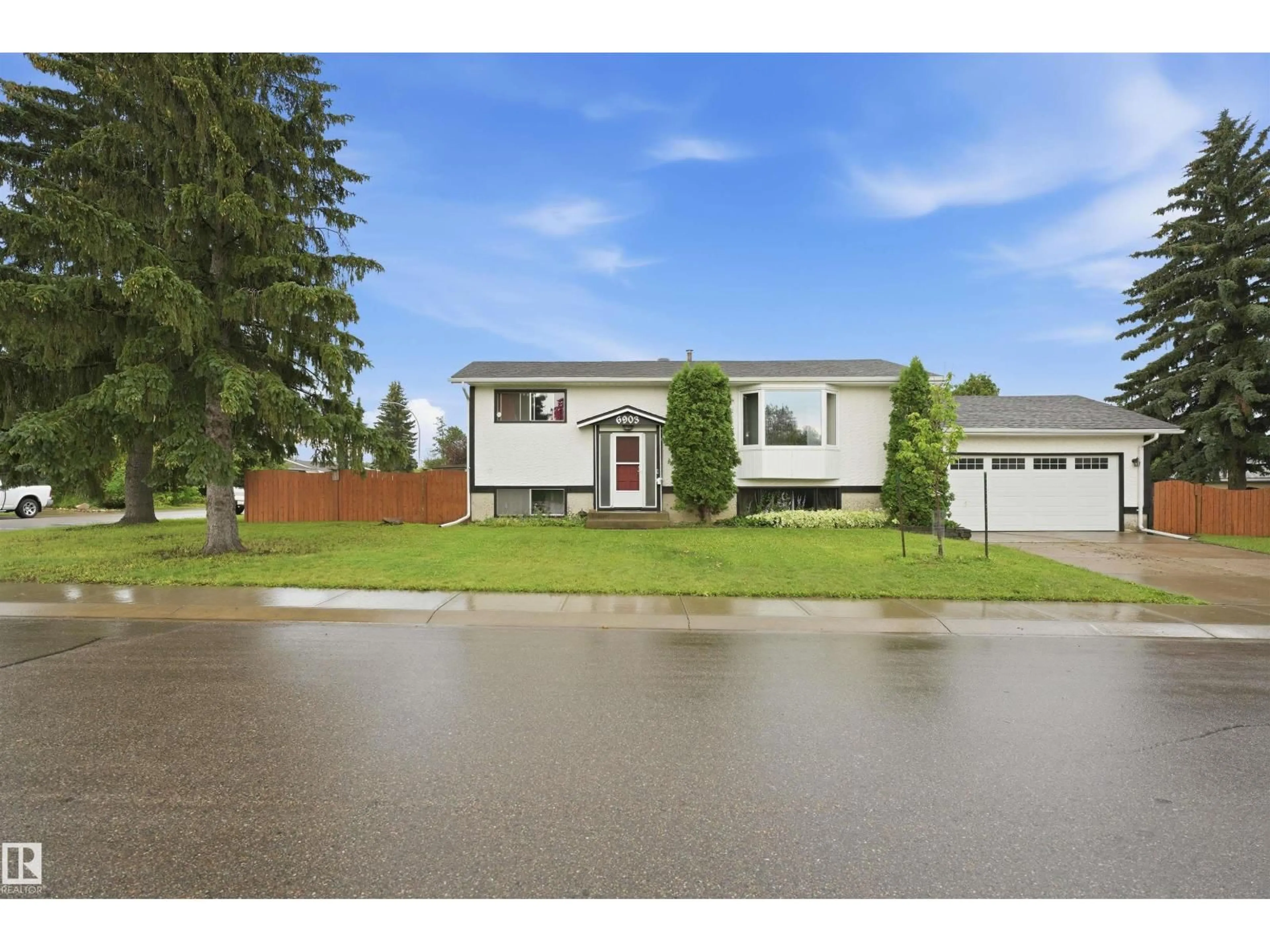 Home with vinyl exterior material, street for 6903 151 AV, Edmonton Alberta T5C2Y6