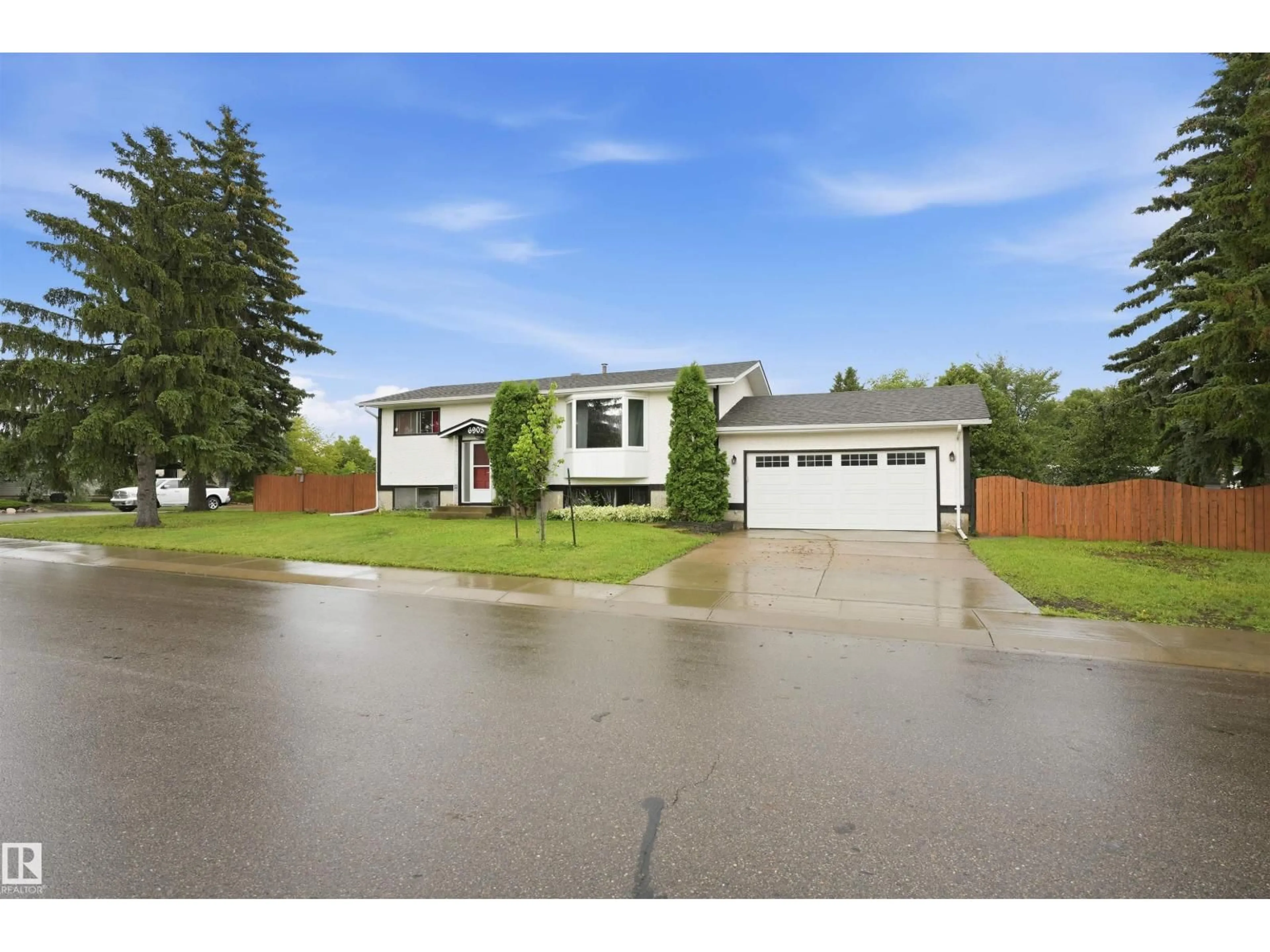 Home with vinyl exterior material, street for 6903 151 AV, Edmonton Alberta T5C2Y6