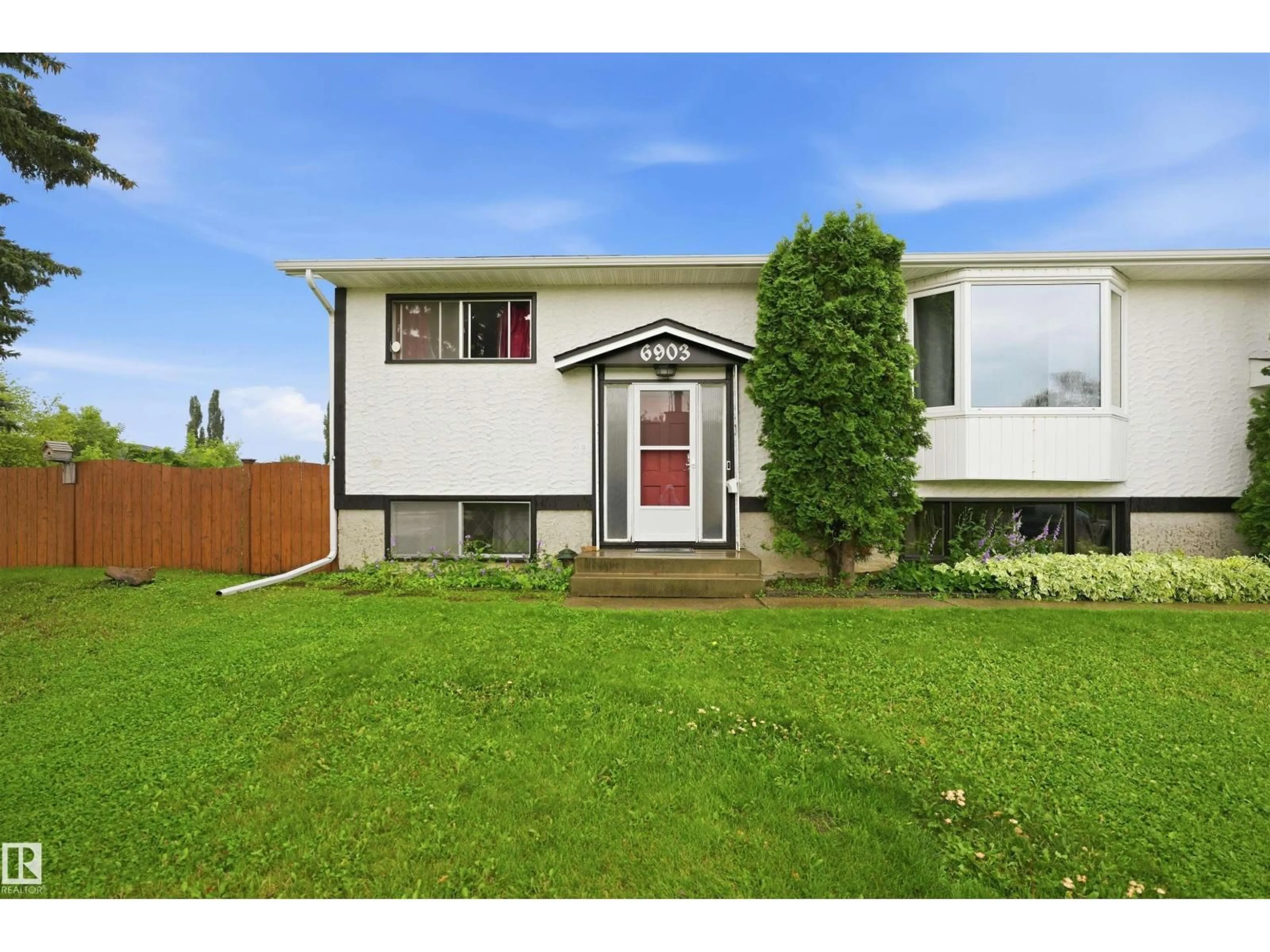 Home with vinyl exterior material, street for 6903 151 AV, Edmonton Alberta T5C2Y6