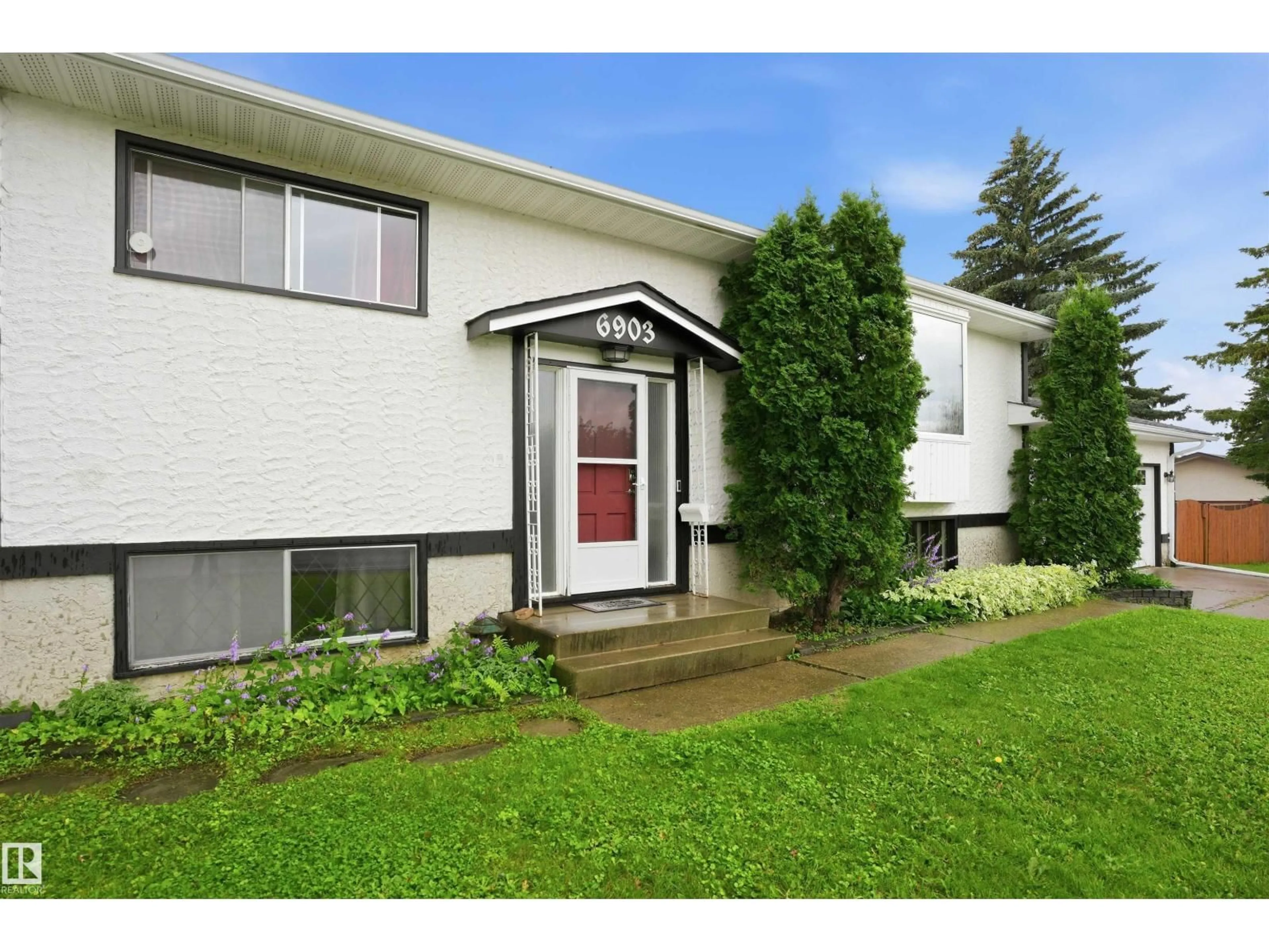 Home with vinyl exterior material, street for 6903 151 AV, Edmonton Alberta T5C2Y6