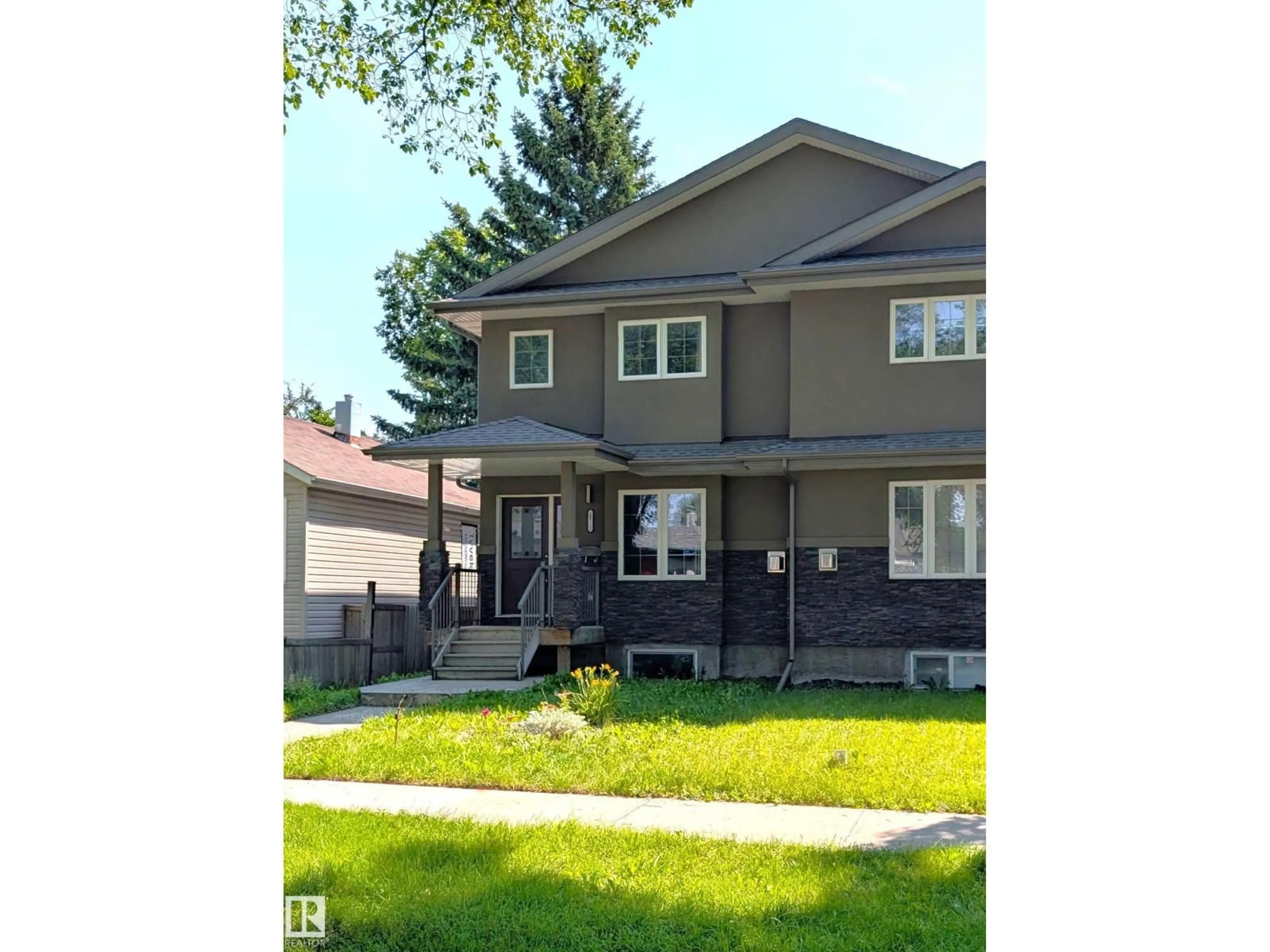 Home with vinyl exterior material, street for 10711 70 AV, Edmonton Alberta T6H2G4