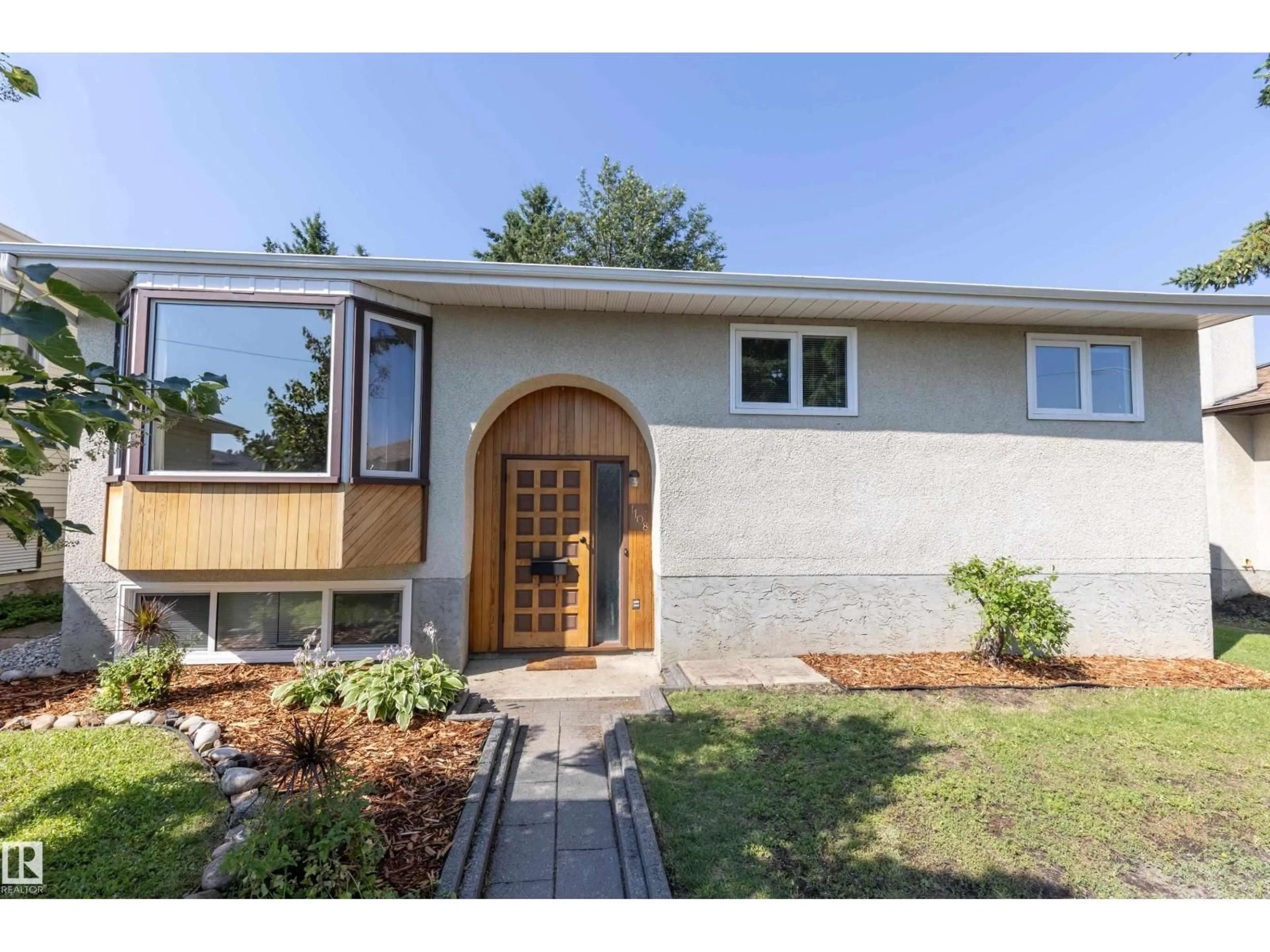 Home with brick exterior material, street for 1108 39 ST, Edmonton Alberta T6L2K7
