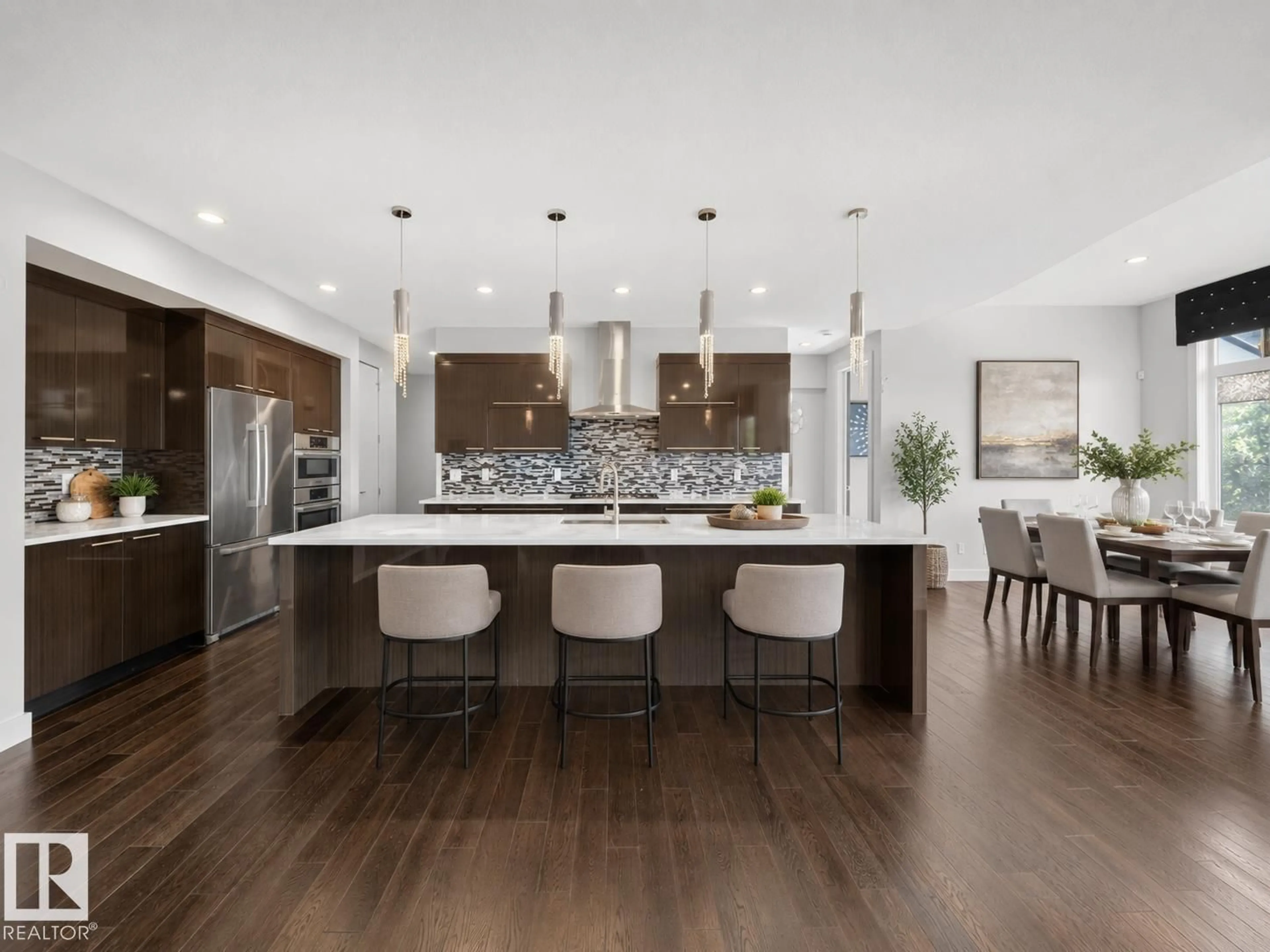 Open concept kitchen, wood/laminate floor for SW - 1116 HAINSTOCK GR, Edmonton Alberta T6W2T8