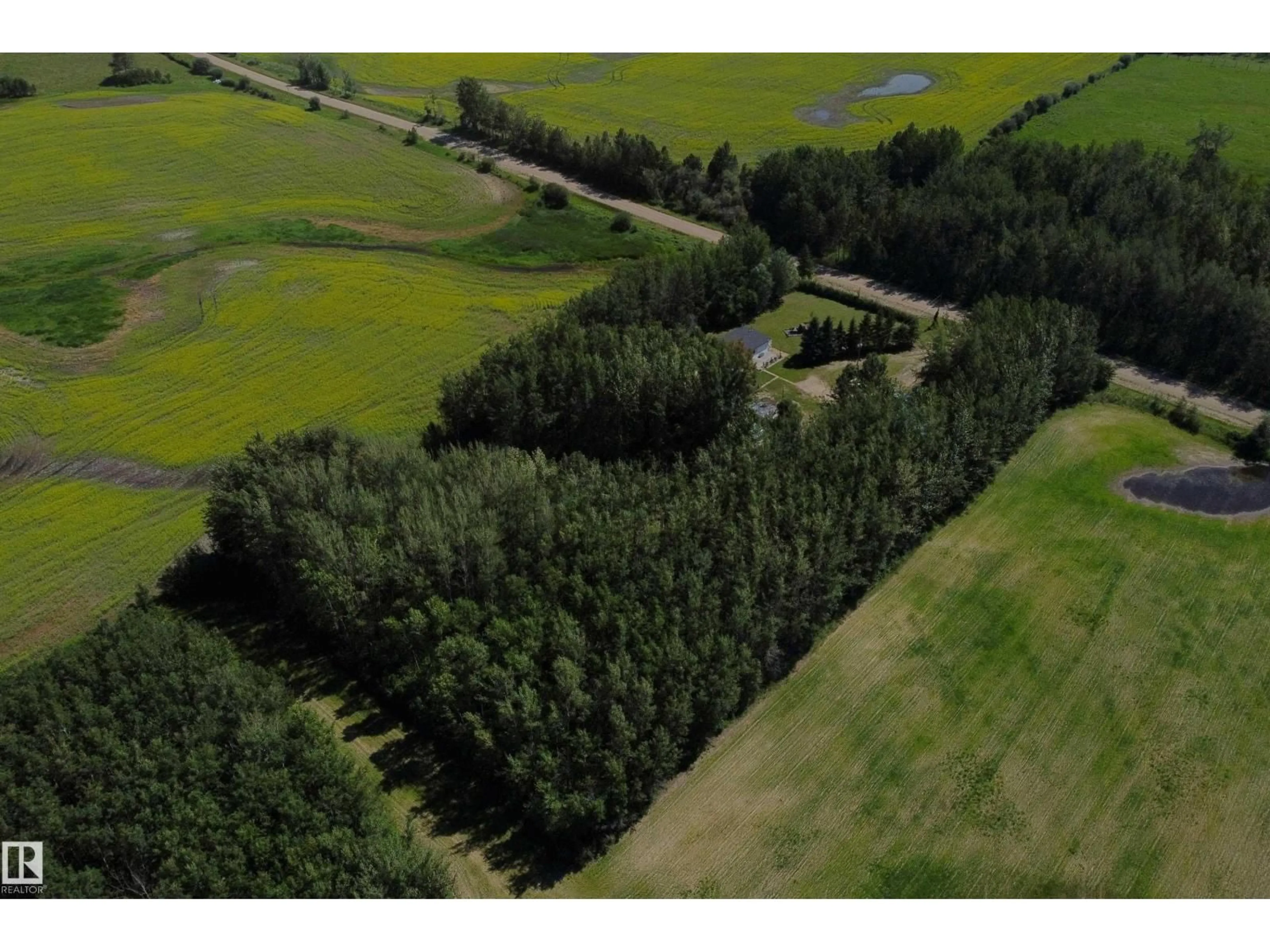 A pic from outside/outdoor area/front of a property/back of a property/a pic from drone, forest/trees view for 5318 TWP RD 612, Rural Barrhead County Alberta T7N1N3